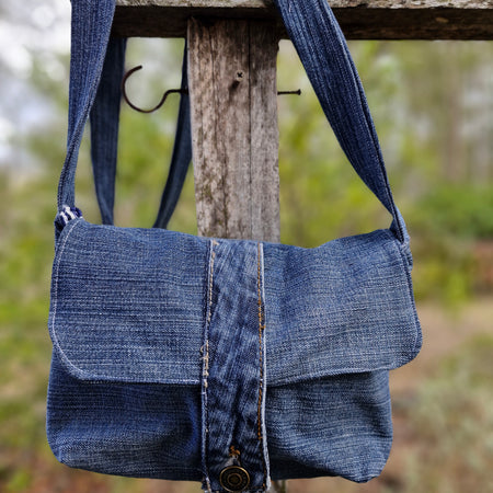 Give old denim a new life with this one-of-a-kind upcycled crossbody bag!