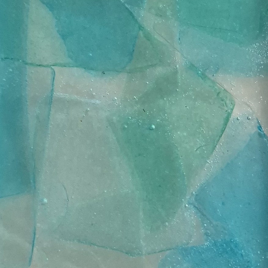 Resin bottle opener with inlaid sea glass