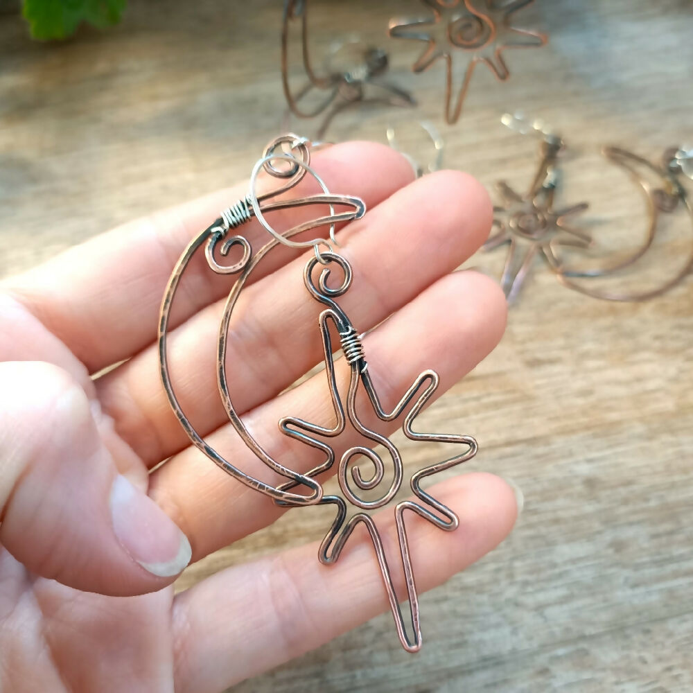 australian-handmade-copper-artisan-celestial-earrings-in-hand