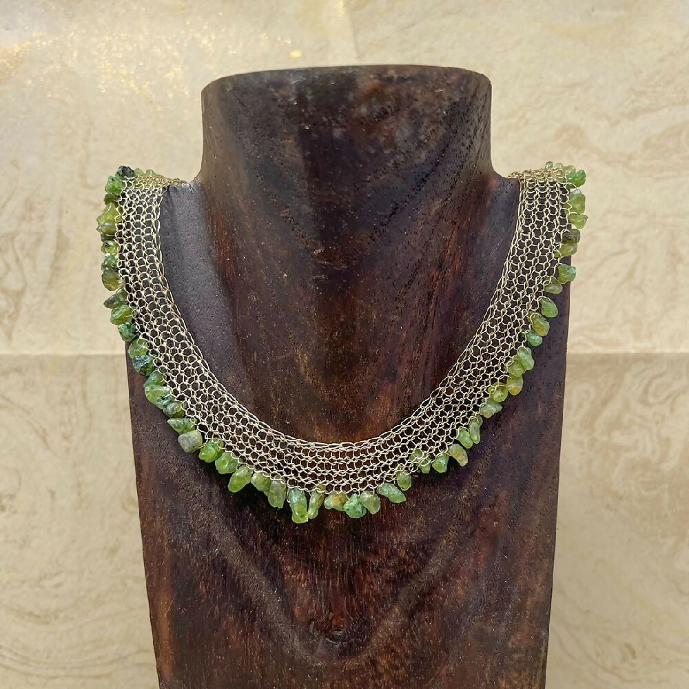 Knitted gold-filled with peridot necklace display