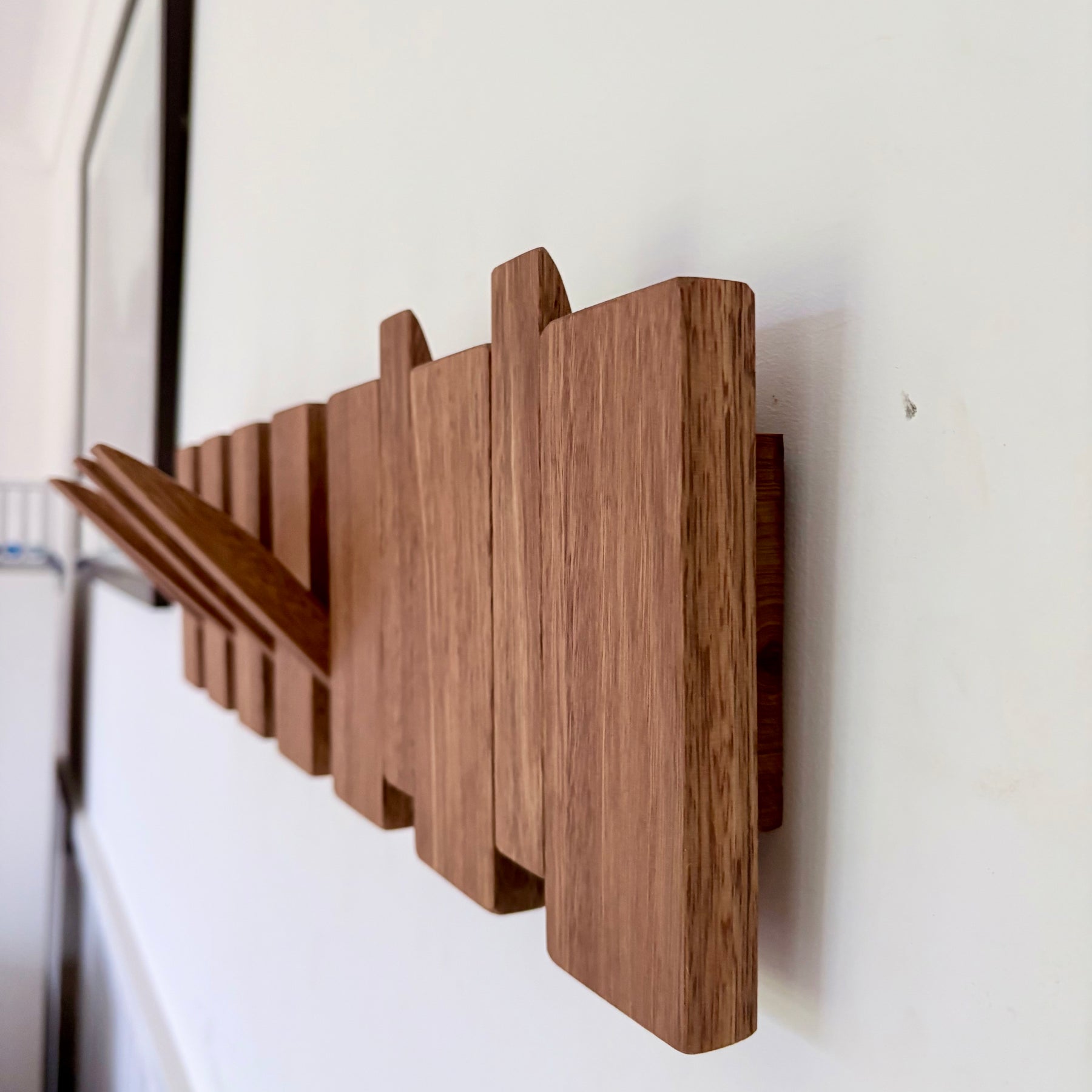 Grey box piano style coat rack