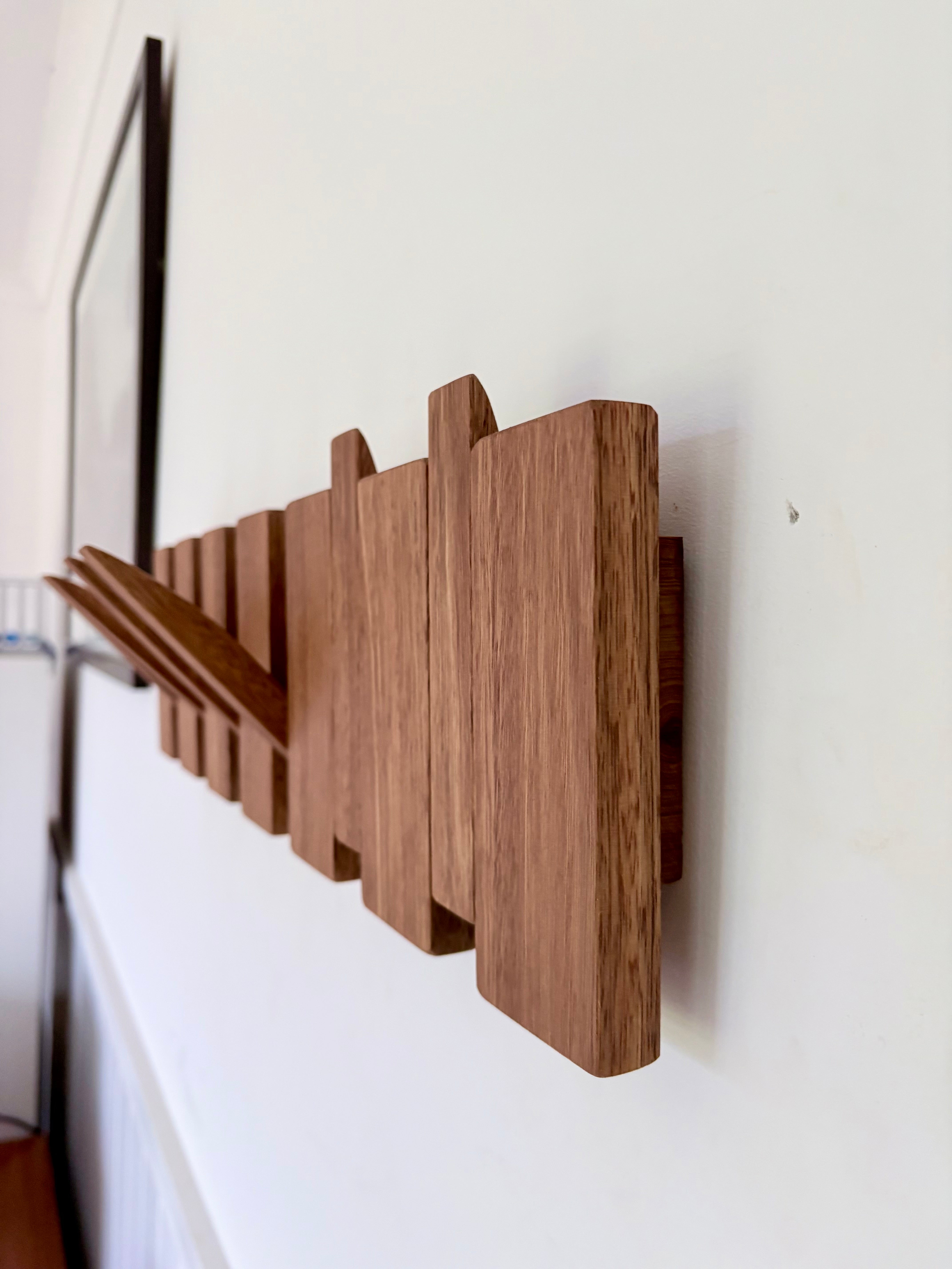 Grey box piano style coat rack