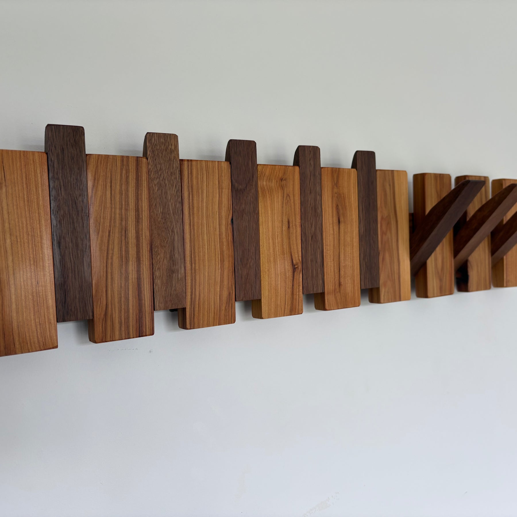 Two tone piano style coatrack