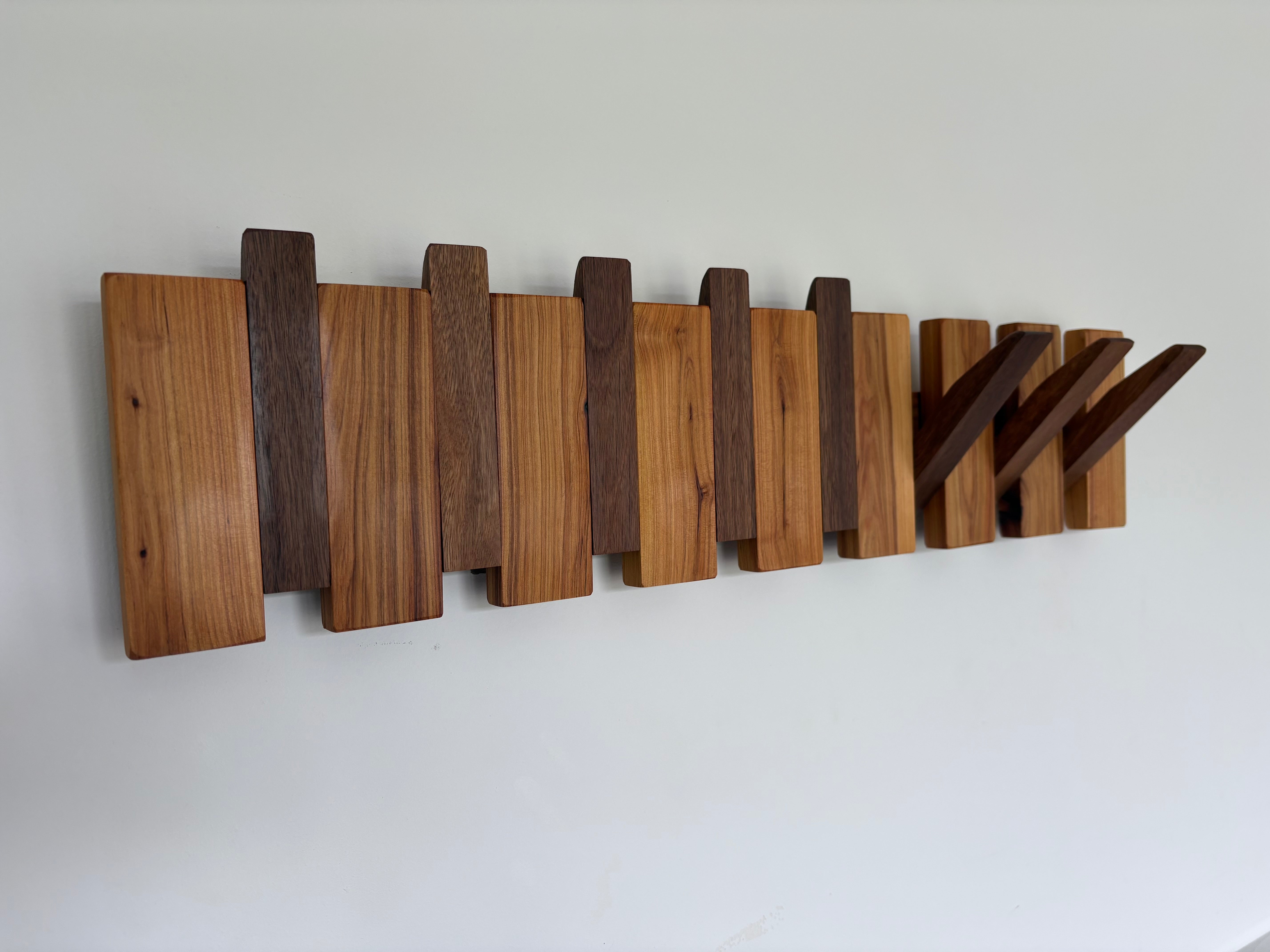 Two tone piano style coatrack