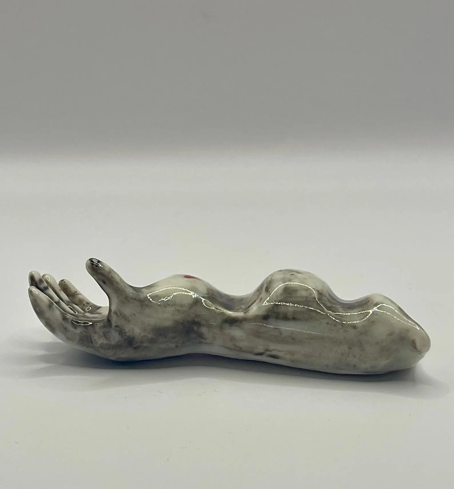 Handmade porcelain ‘helping hand’ brush rest