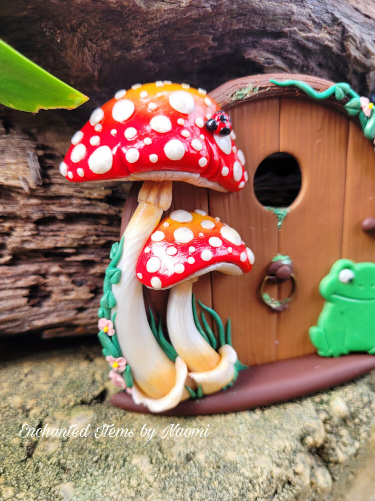 A little Frog at a Mushroom Fairy Door