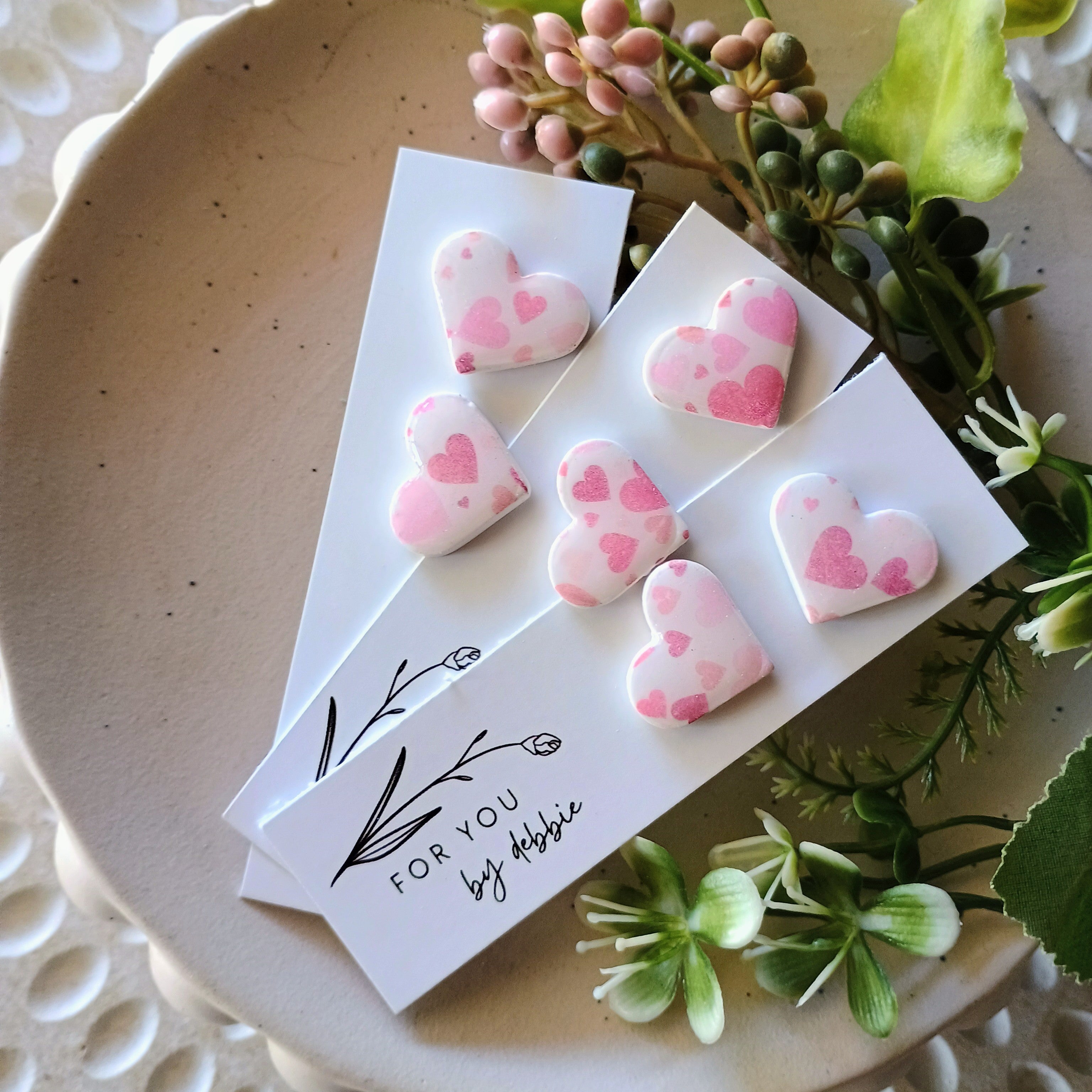 White and pink heart stud earrings
