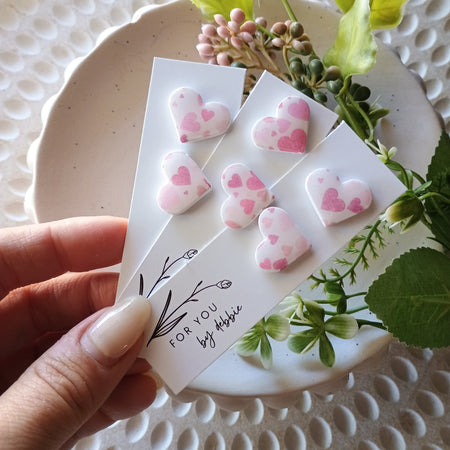 White and pink heart stud earrings