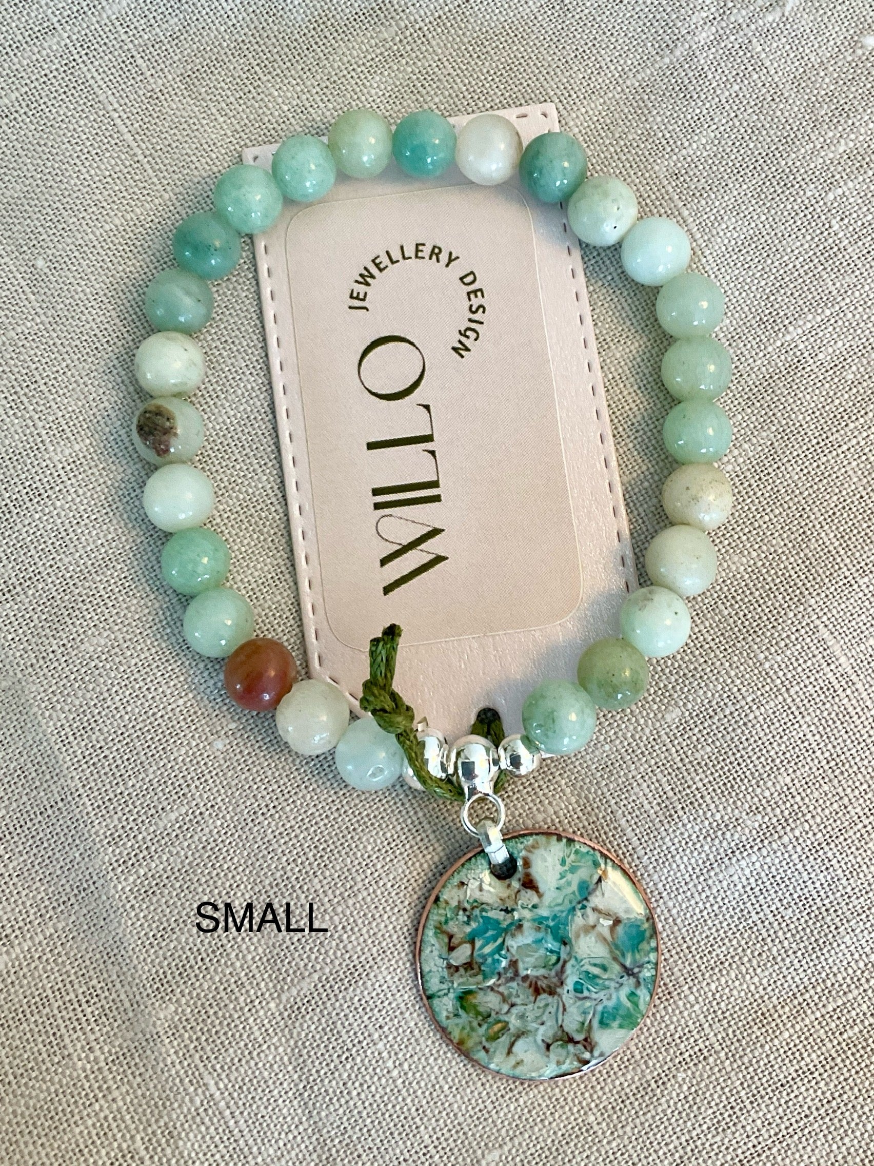 Amazonite gemstone bracelet with enamel charm.