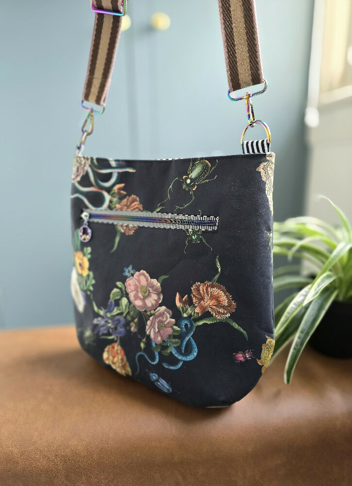 Large black crossbody bag. Snakes, bugs and flowers.