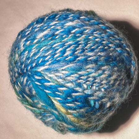 Wool cake in blues and greens