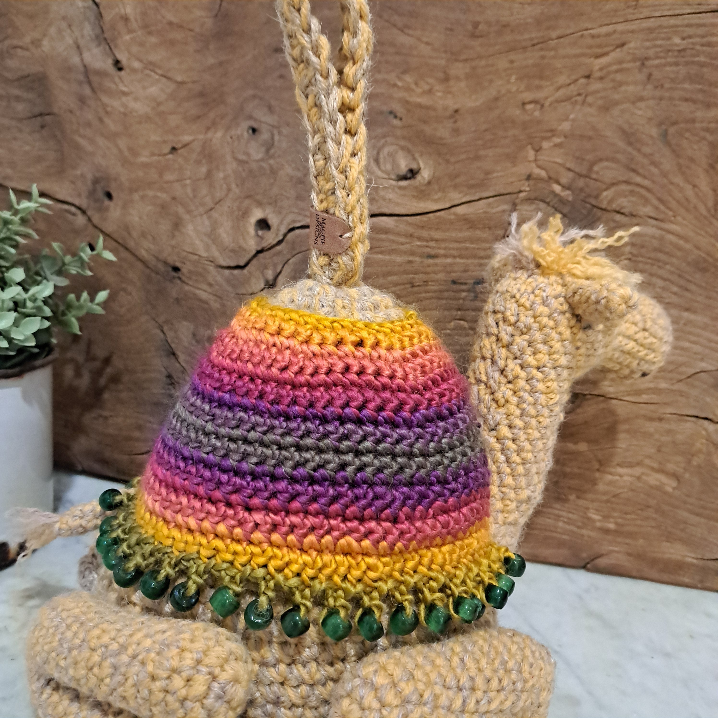 Handmade crochet camel doorstop colourful coat mustard coloured base