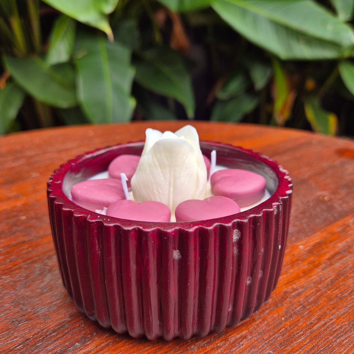 Round burgundy concrete bowl candle with tulip flower
