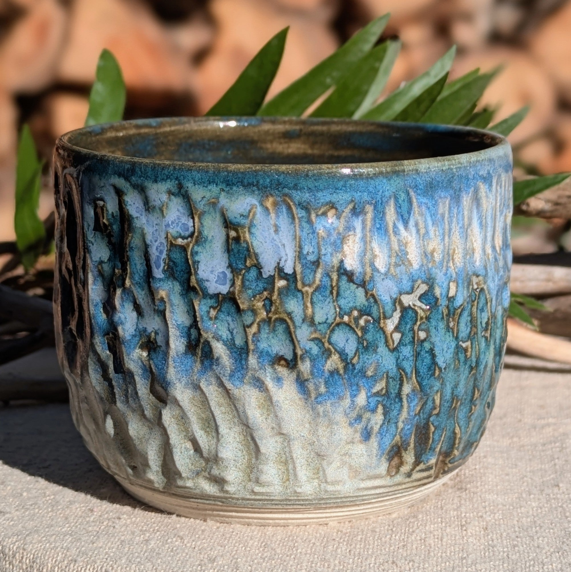 Small blue-green tea or espresso cup