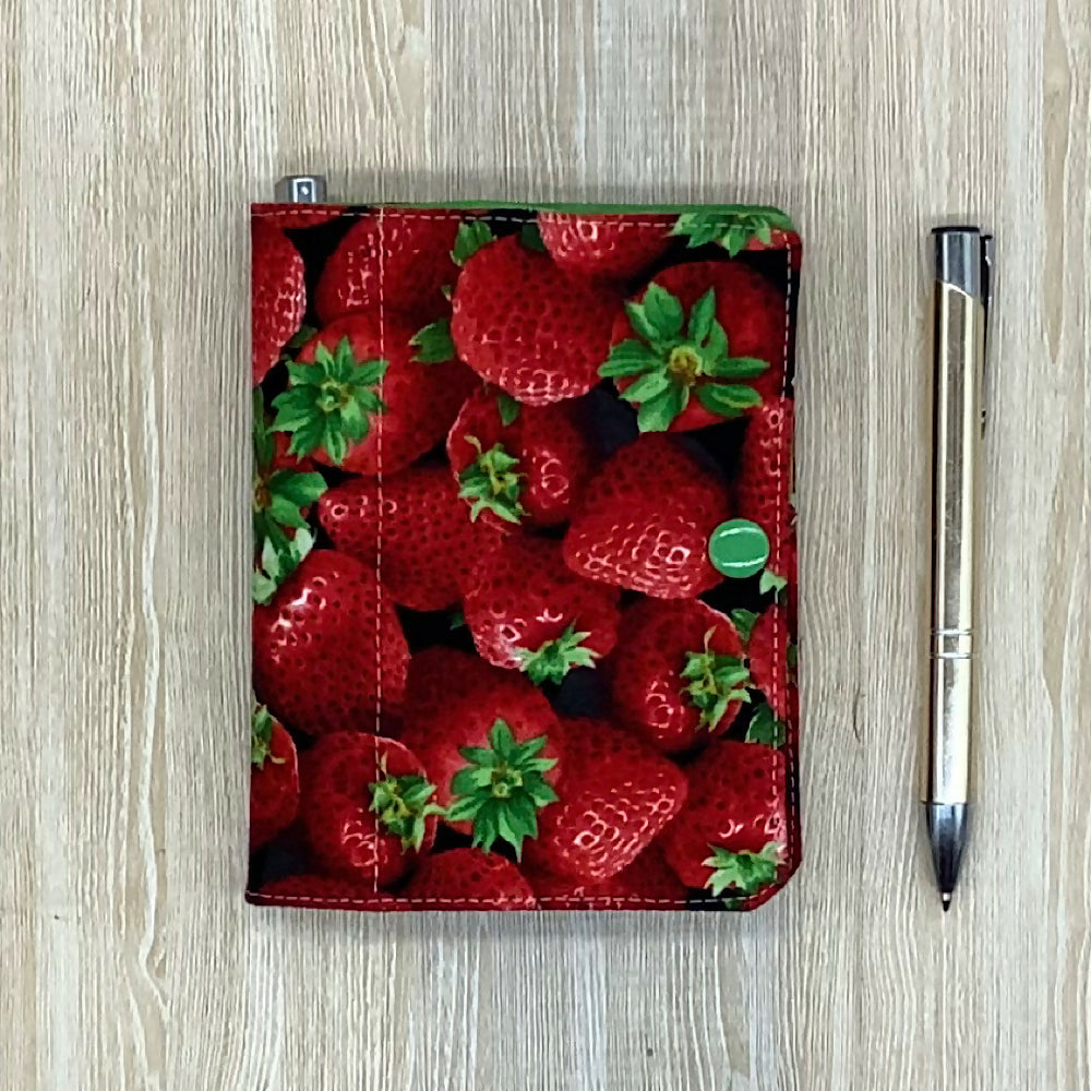 Strawberries refillable fabric pocket notepad cover with snap closure. Incl. book and pen.