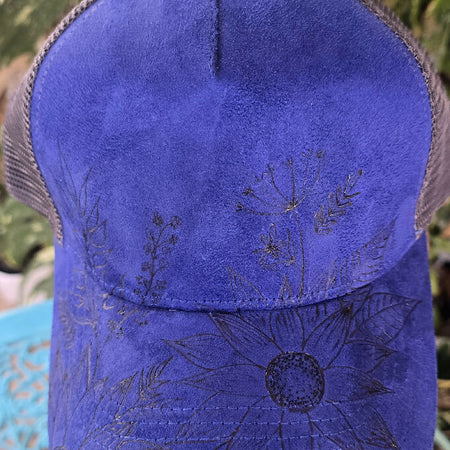 Blue baseball cap with flower pyrography