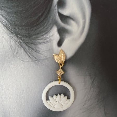 White Earrings With Gold Findings in Different Designs.