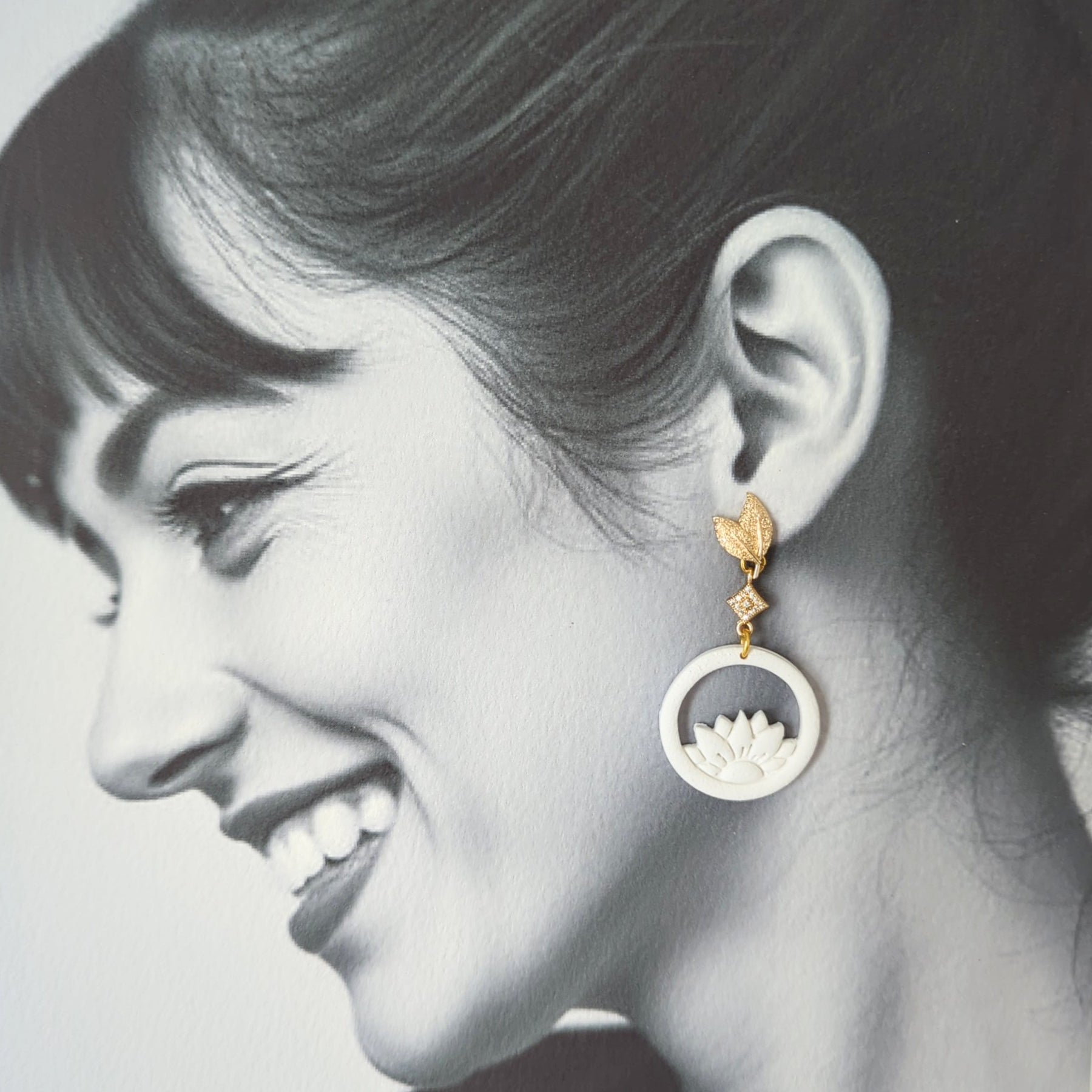White Earrings With Gold Findings in Different Designs.