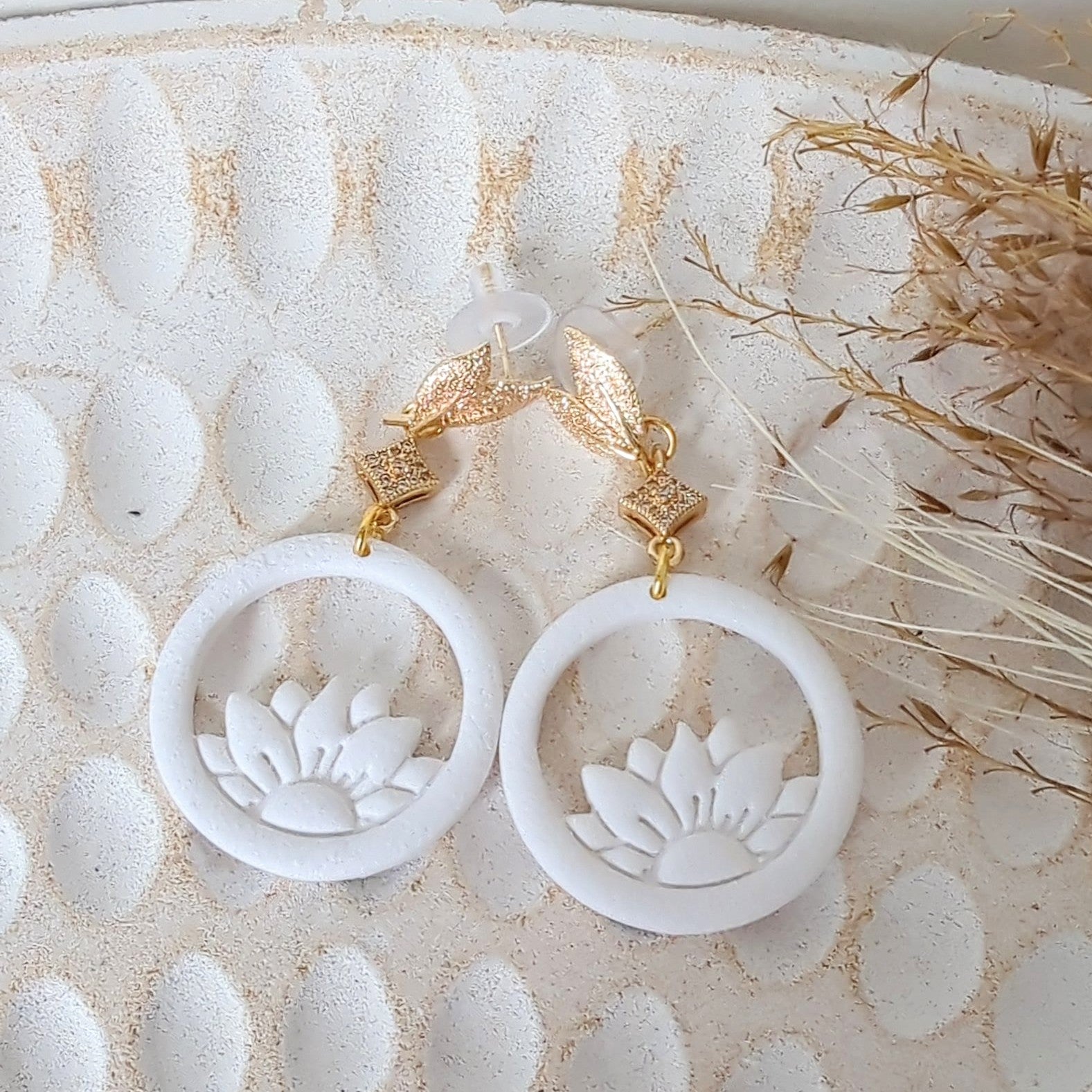 White Earrings With Gold Findings in Different Designs.