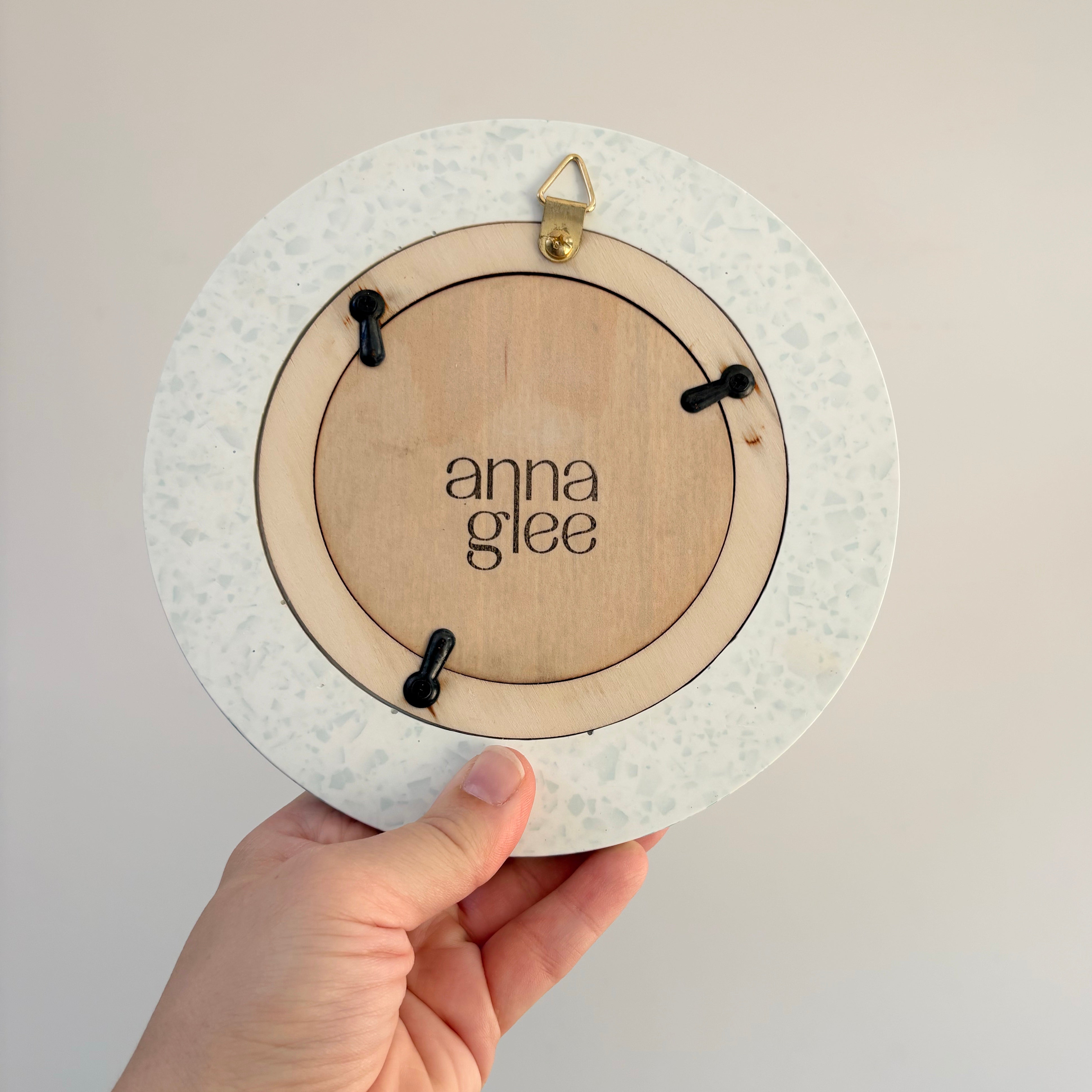 Bright teal green and white terrazzo pattern wall hanging picture frame