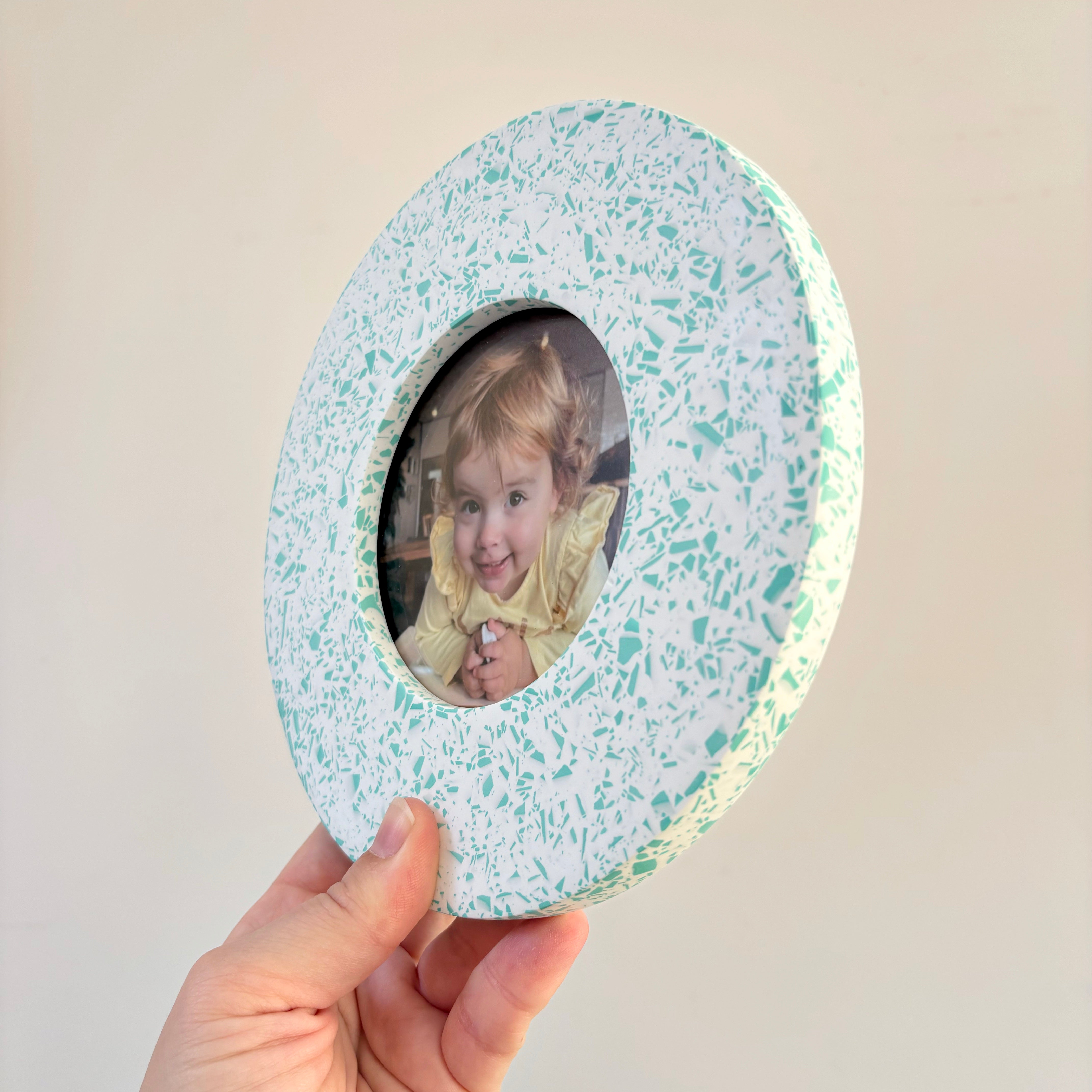 Bright teal green and white terrazzo pattern wall hanging picture frame