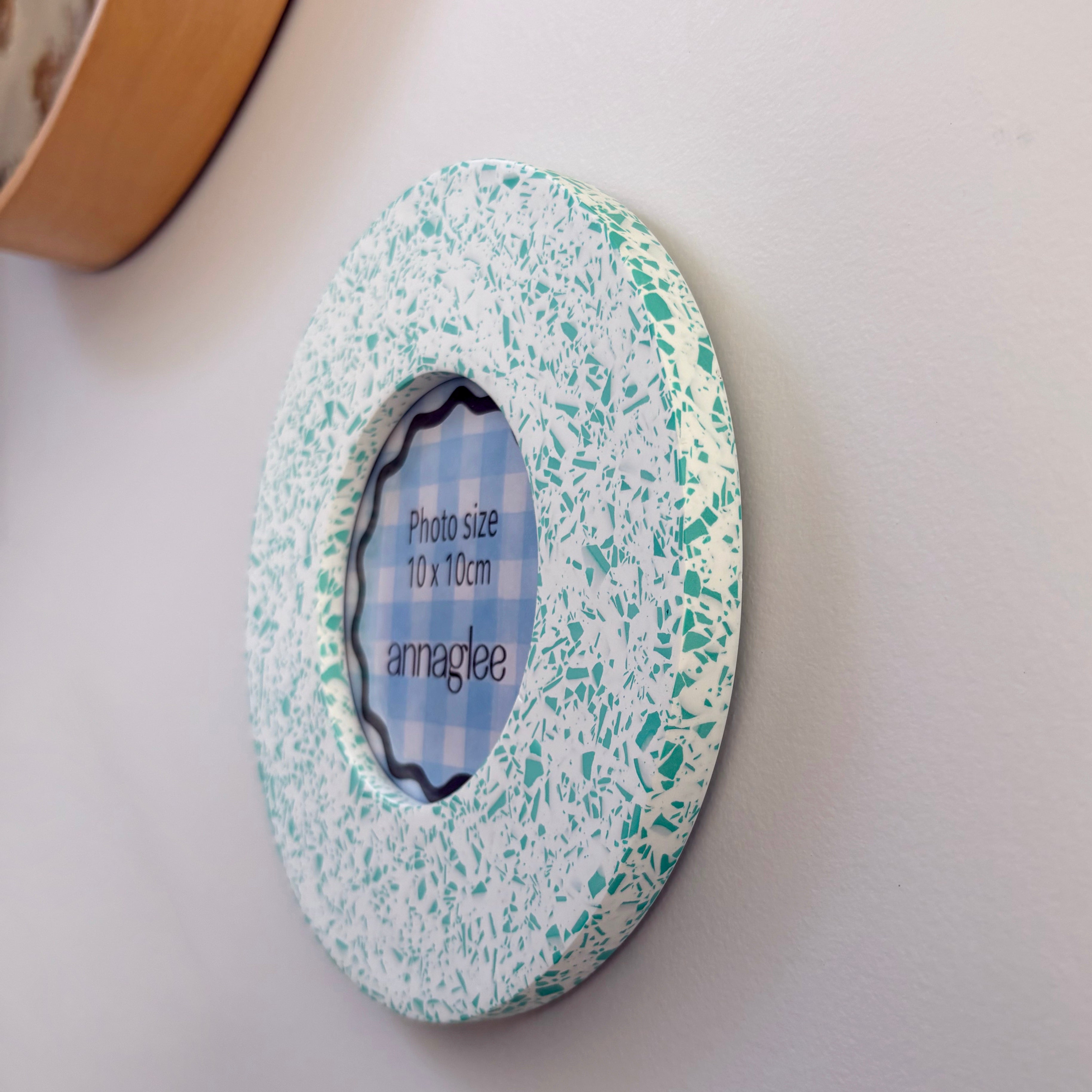 Bright teal green and white terrazzo pattern wall hanging picture frame