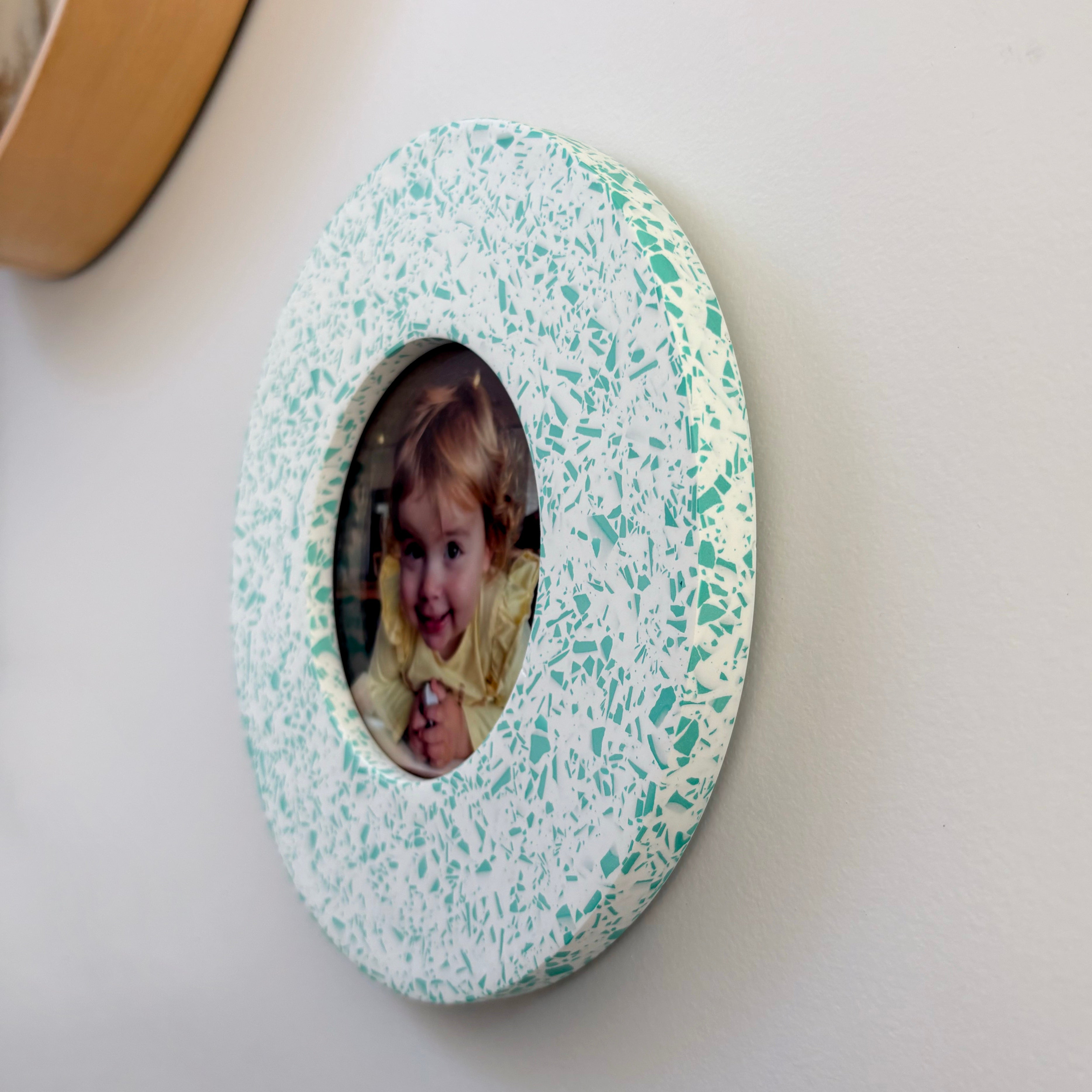 Bright teal green and white terrazzo pattern wall hanging picture frame