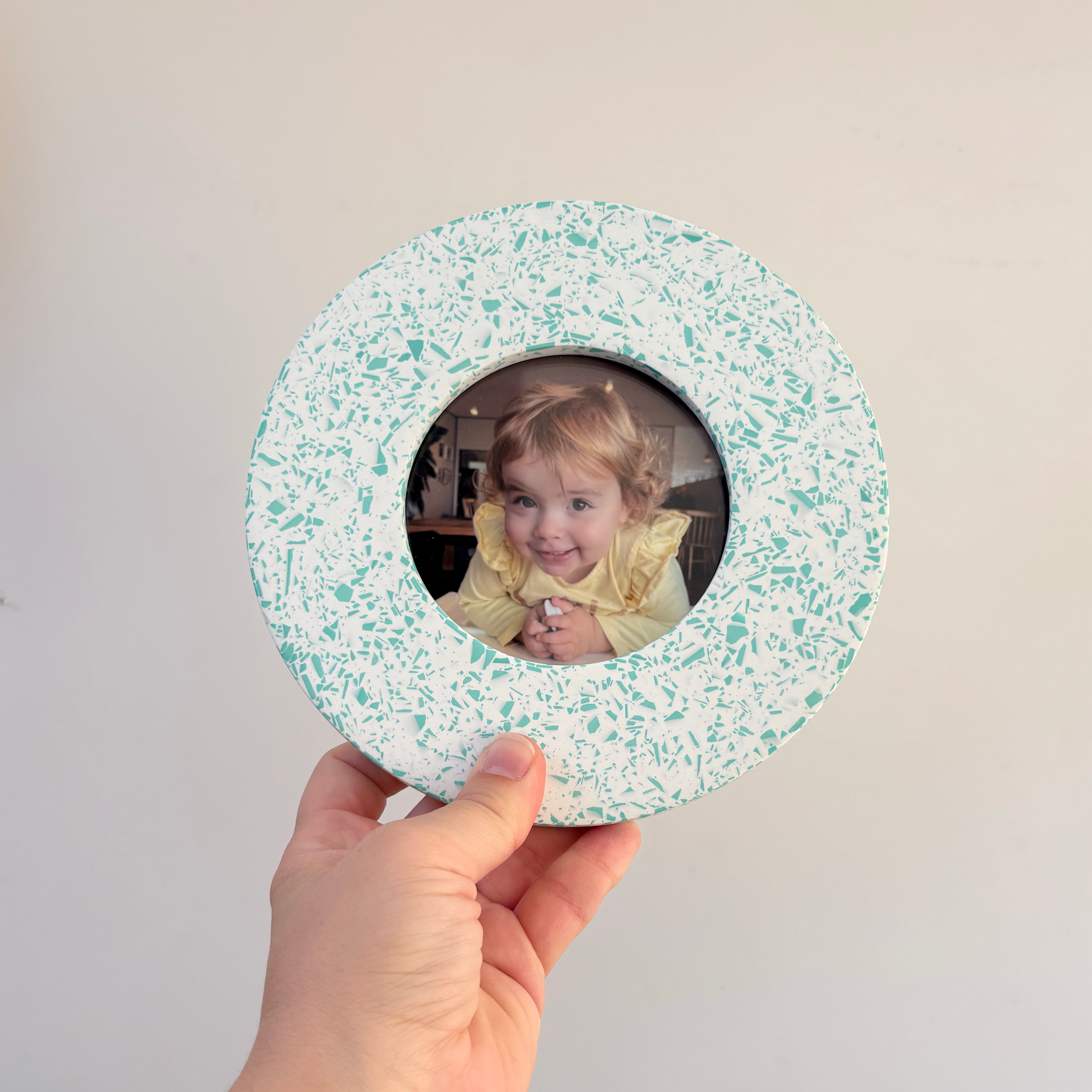 Bright teal green and white terrazzo pattern wall hanging picture frame