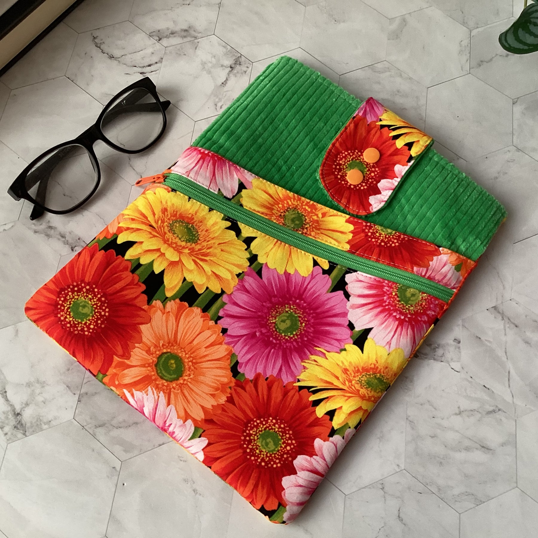 Colourful daisies book sleeve with 2 pockets. iPad, tablet pouch