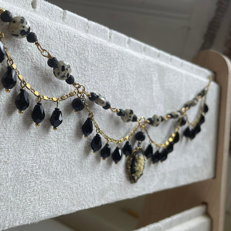 Black and brass beaded statement necklace with cameo charm