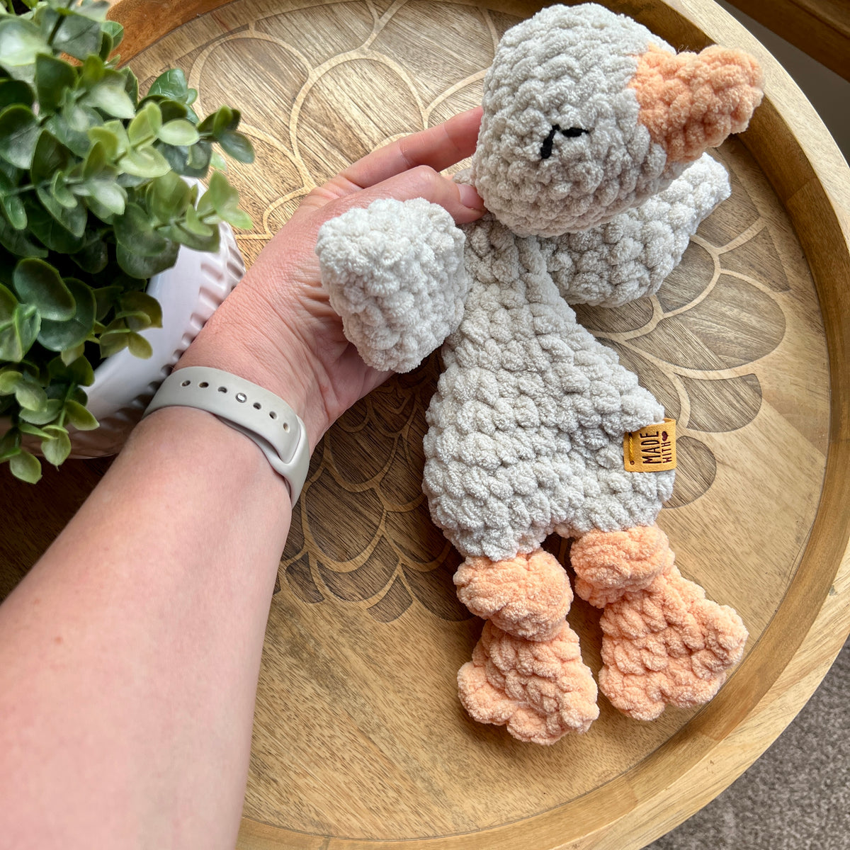 Handmade crochet Mini Goose modern lovey with knotted legs.