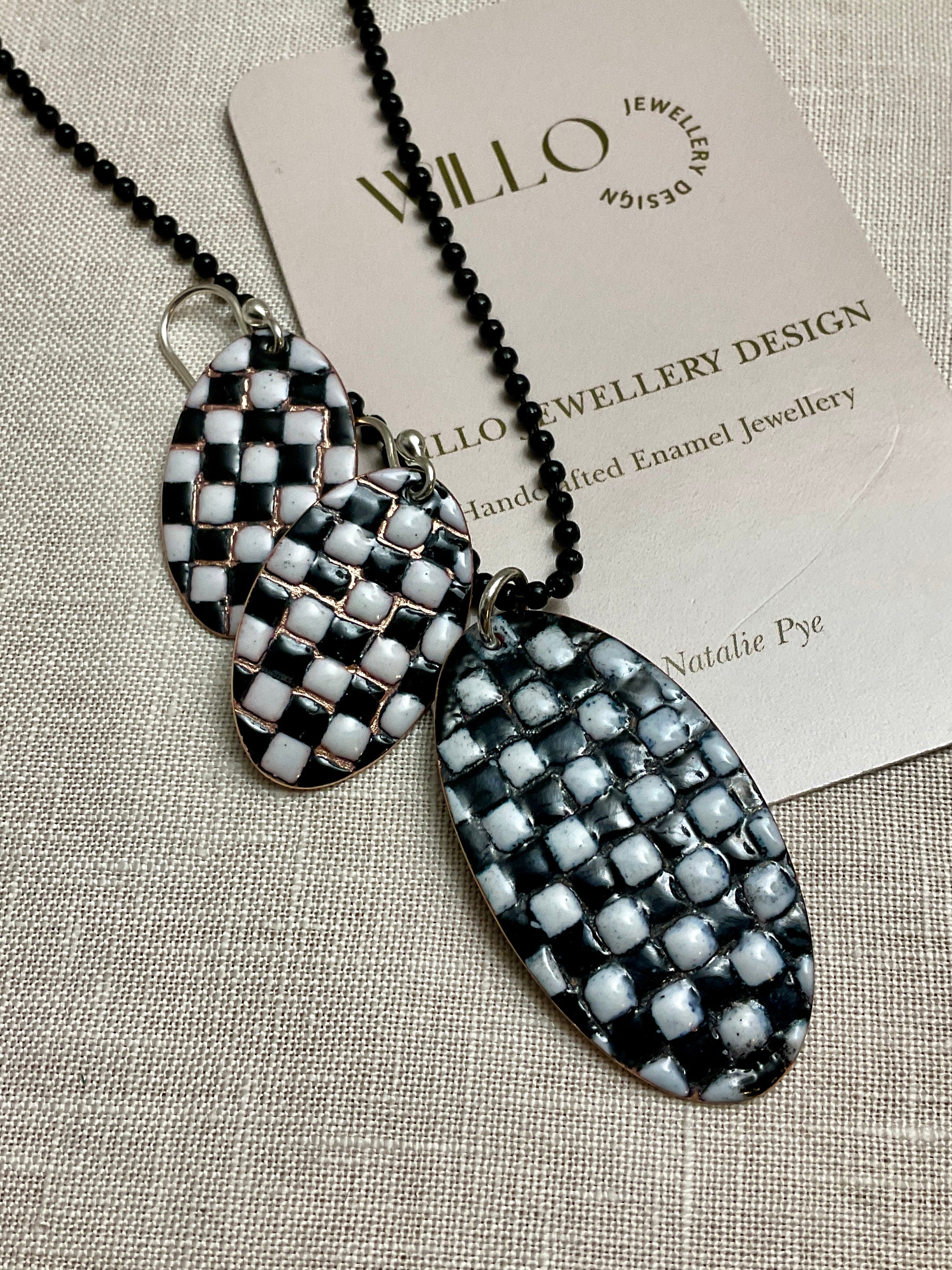 Black and white patchwork enamel pendant. Copper and enamel