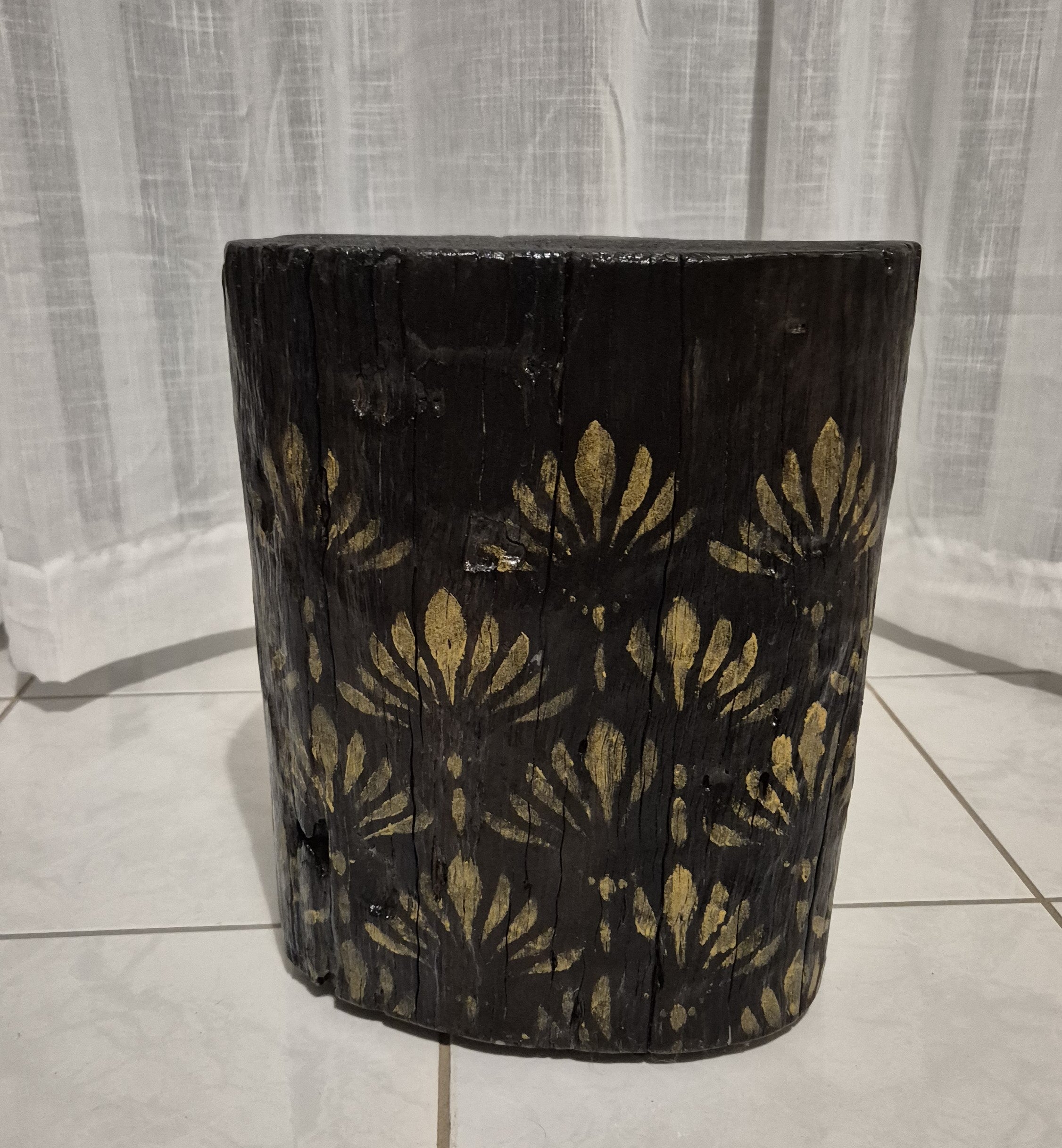 Burnt Timber stump table featuring gold hand-painted artwork