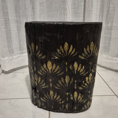 Burnt Timber stump table featuring gold hand-painted artwork