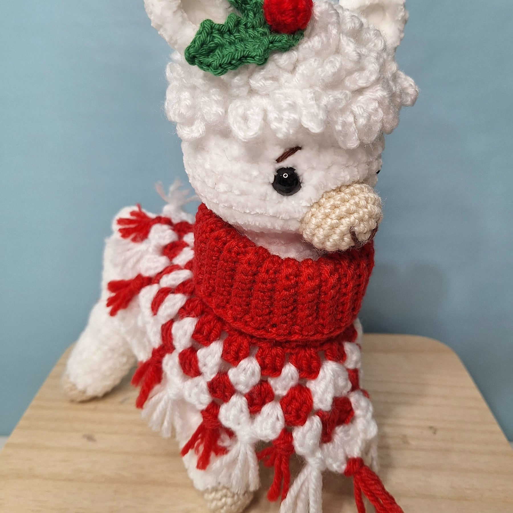 Crocheted Christmas Alpaca wearing a Poncho