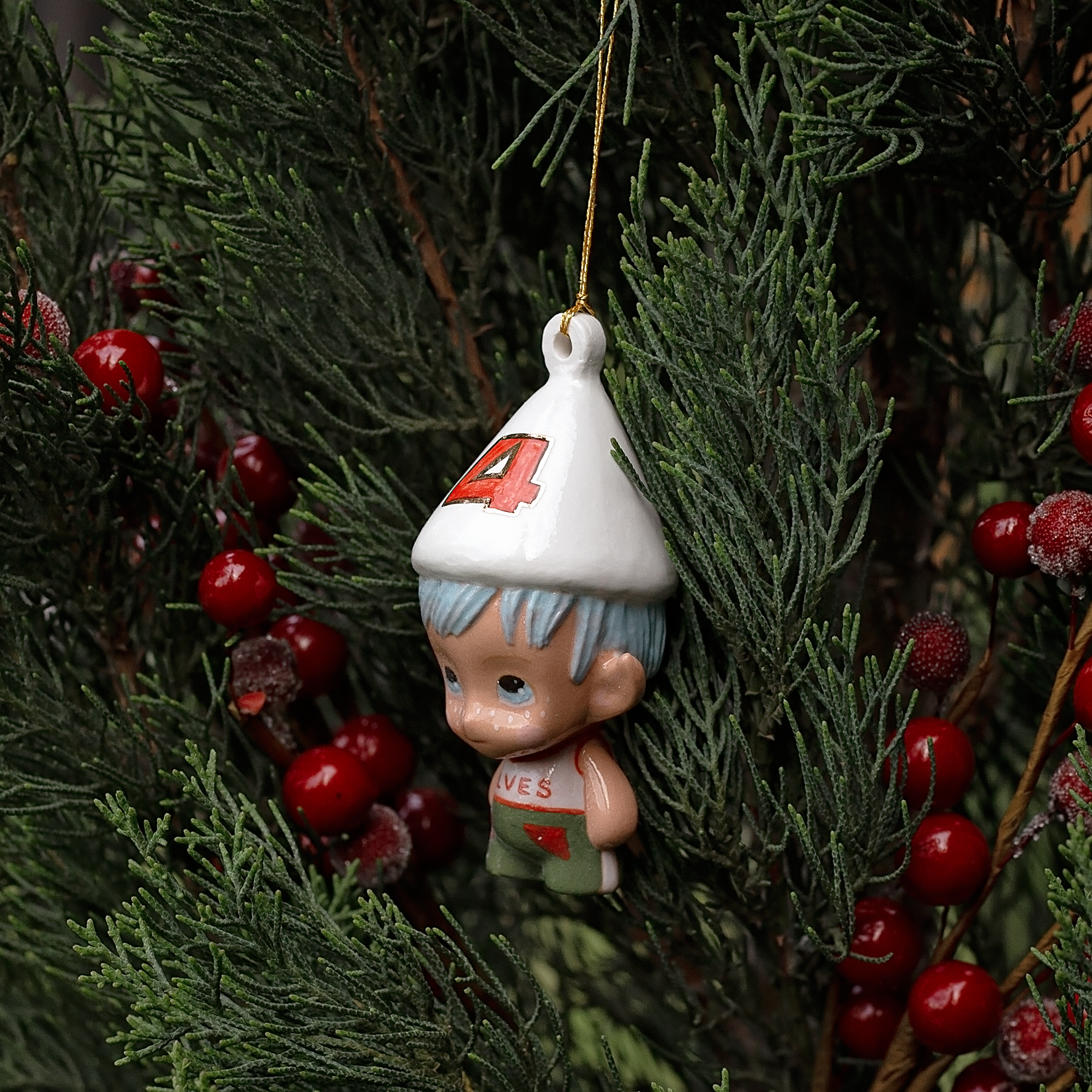 Handmade Porcelain Christmas ornament. One-of-a-kind. Kade the footy Elf.