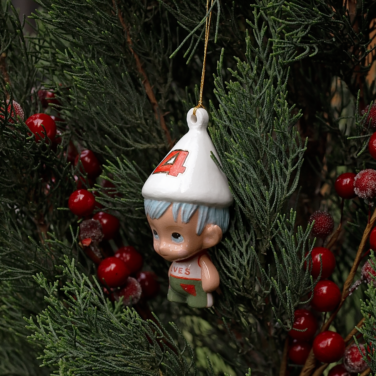 Handmade Porcelain Christmas ornament. One-of-a-kind. Kade the footy Elf.