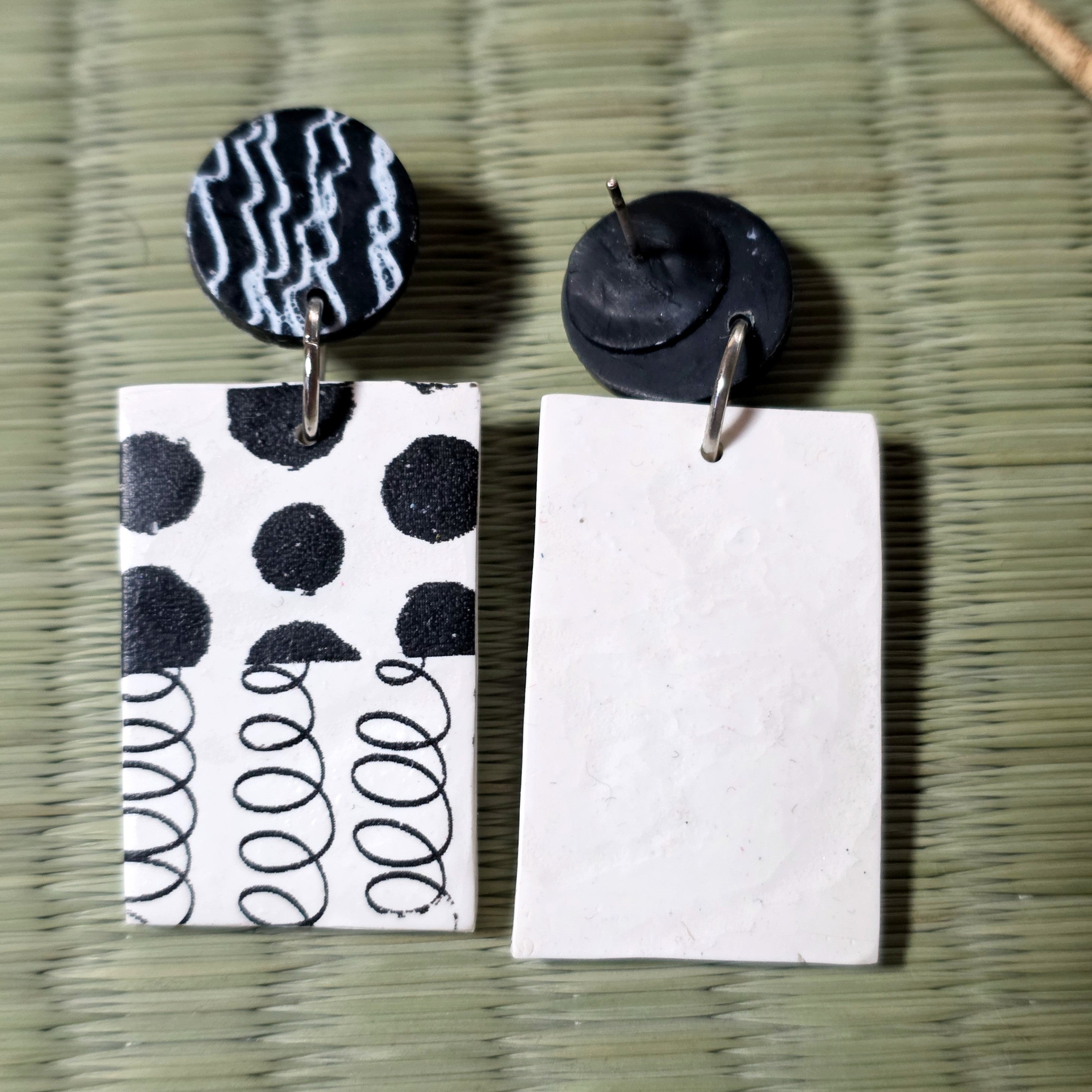 Black and white stud earrings
