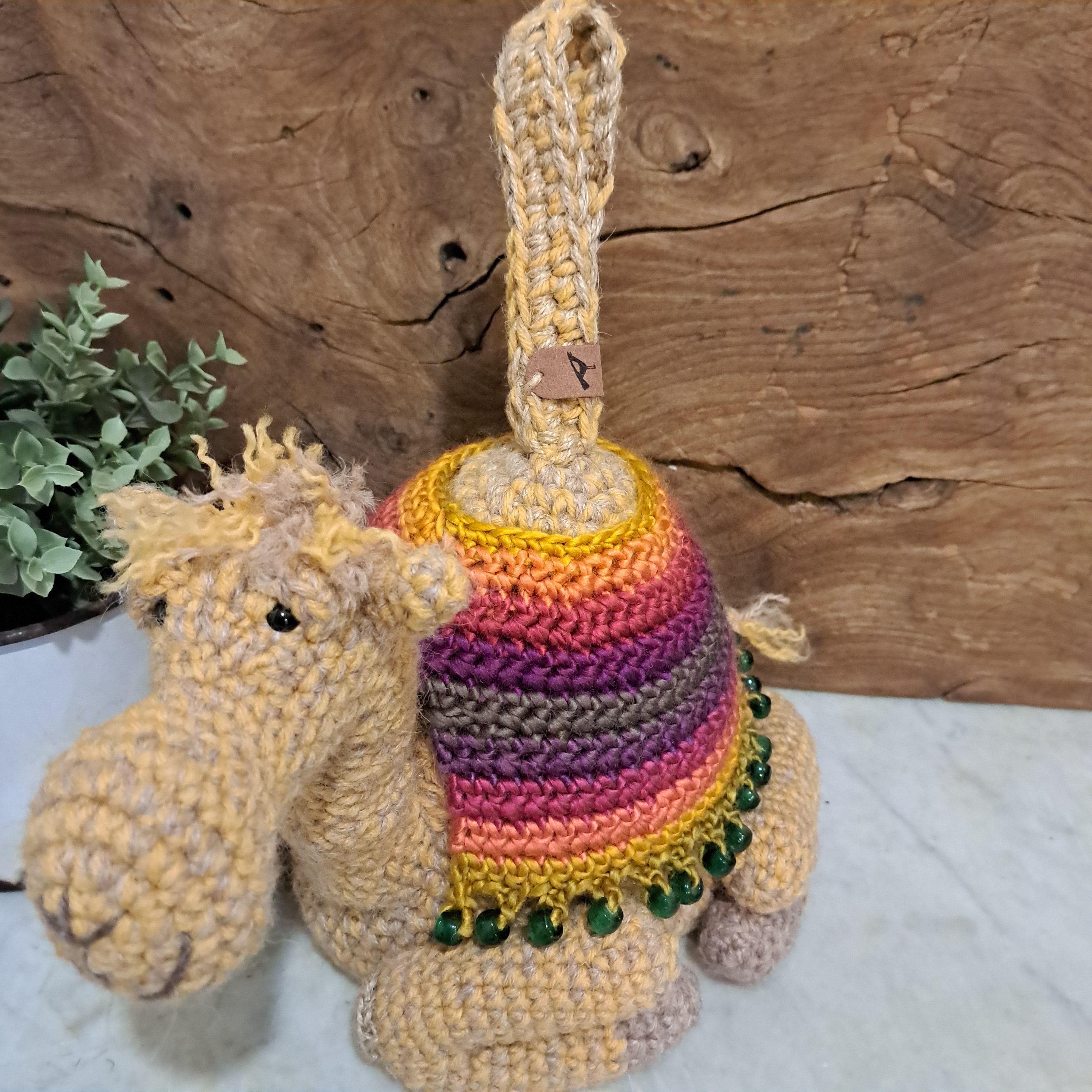 Handmade crochet camel doorstop colourful coat mustard coloured base
