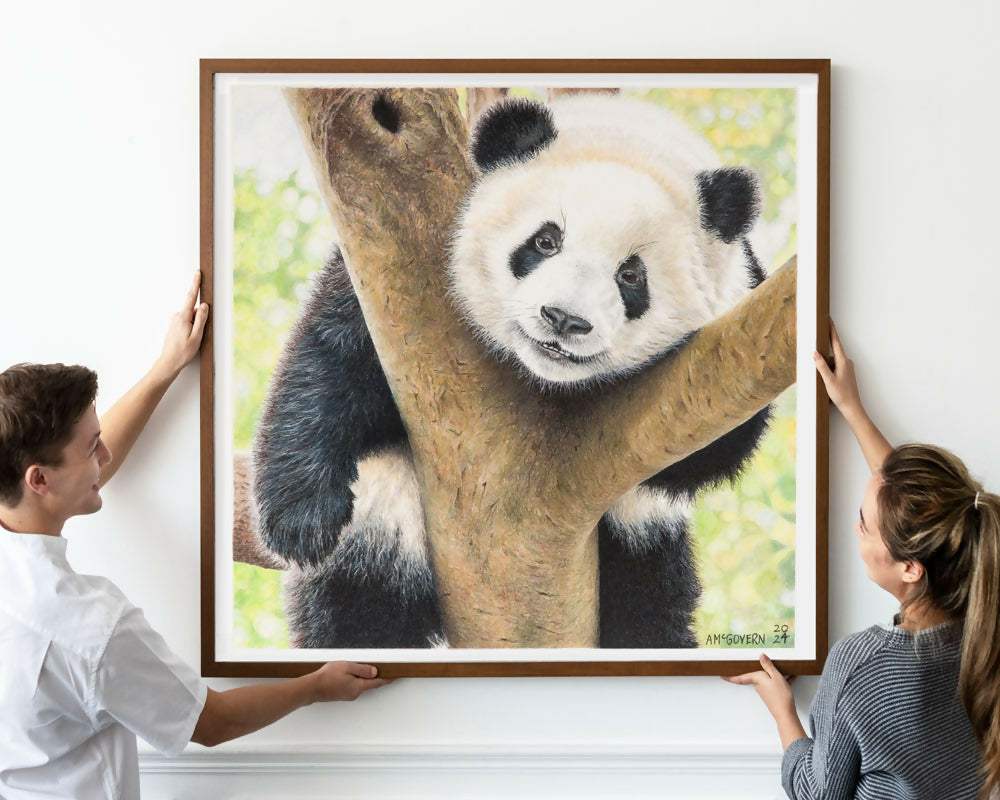 PANDA-painting-being-hung-by-couple-WEB