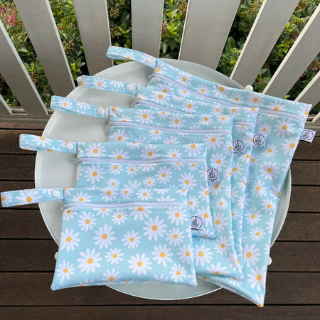 Water-resistant wet bags - Scattered Daisy Ditsy Floral Print in Aqua Blue, White and Yellow - (Bianca Stanton)