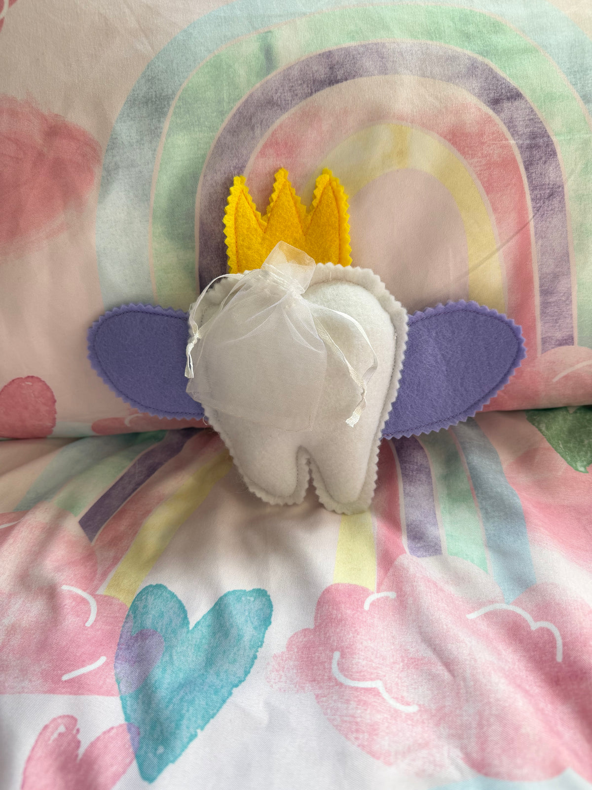 Tooth fairy snuggle toy with tooth pouch