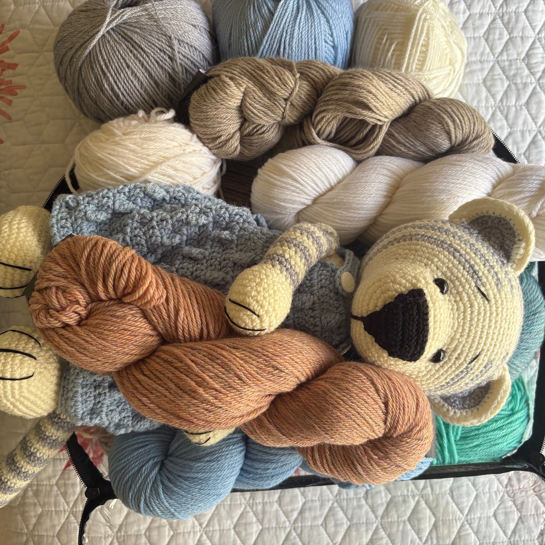 Crochet tiger in blue overalls