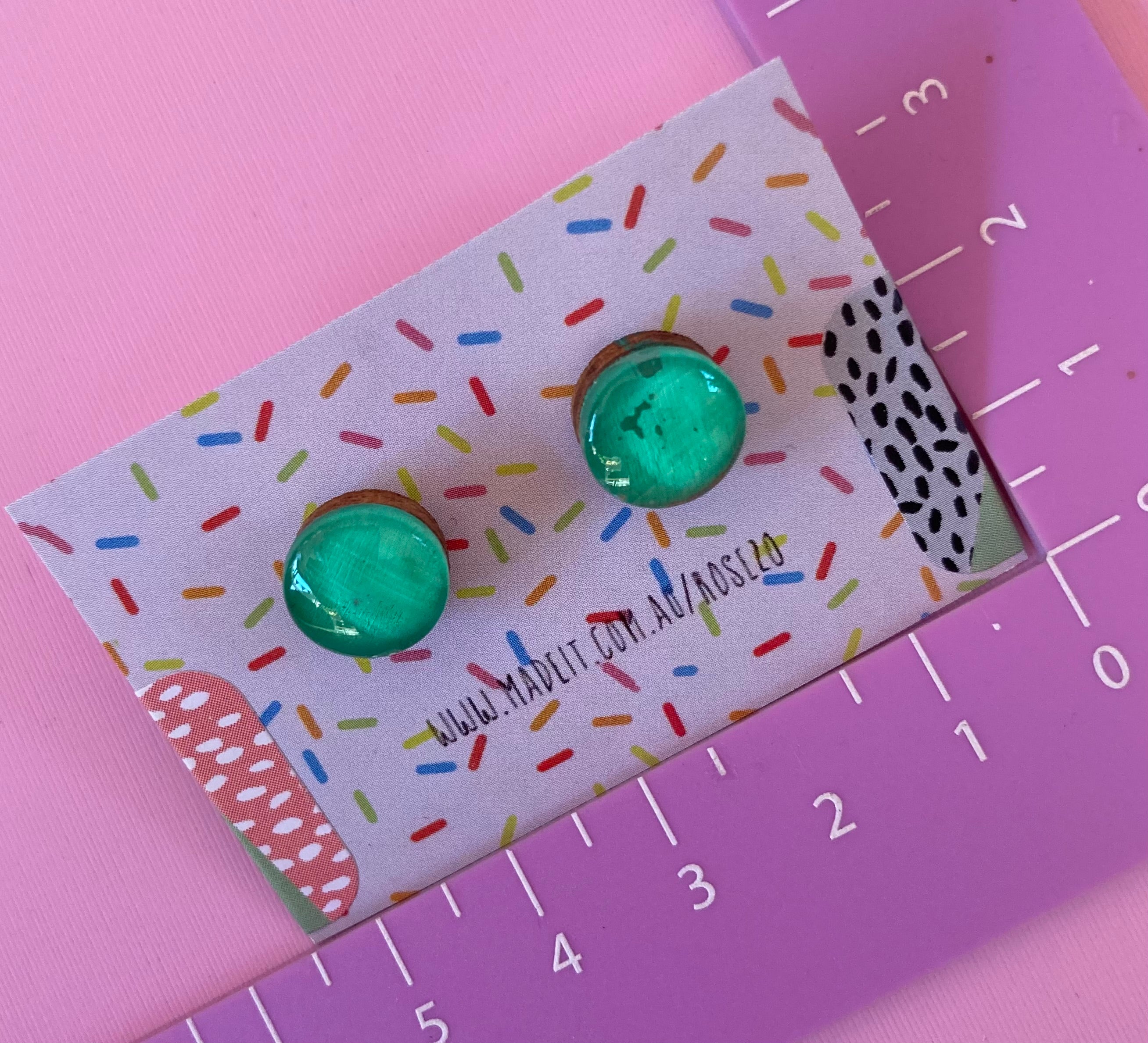 Green glass domed studs