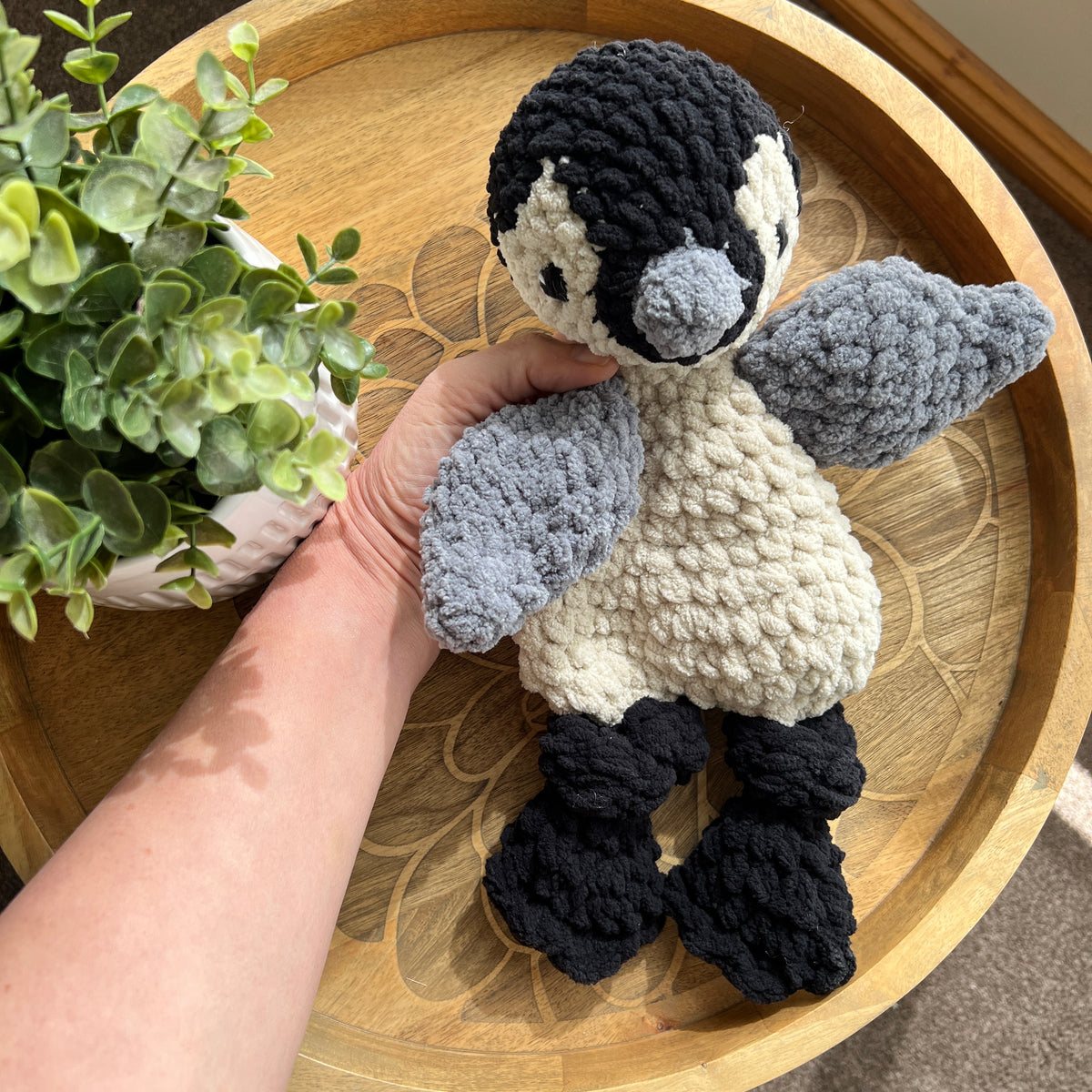 Handmade crochet modern Penguin lovey snuggler with knotted legs.