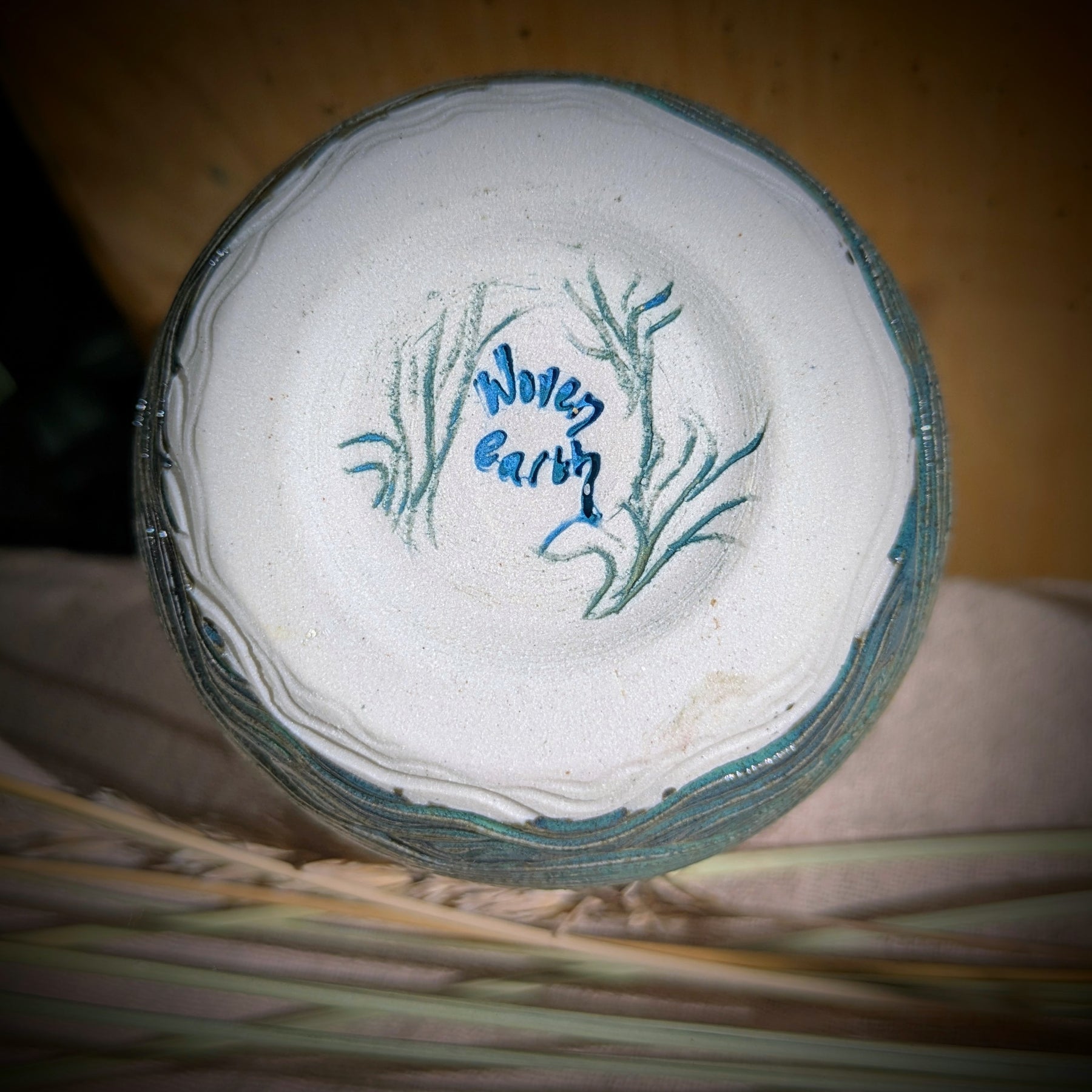Sand dunes reeds and water tumbler