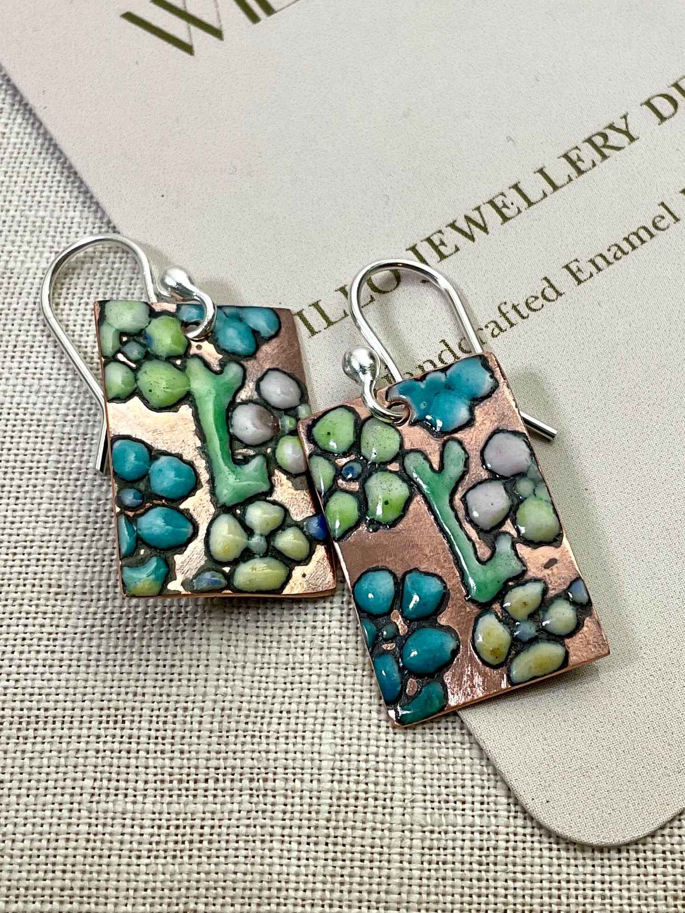 Flowers. Embossed enamel earrings. Handmade