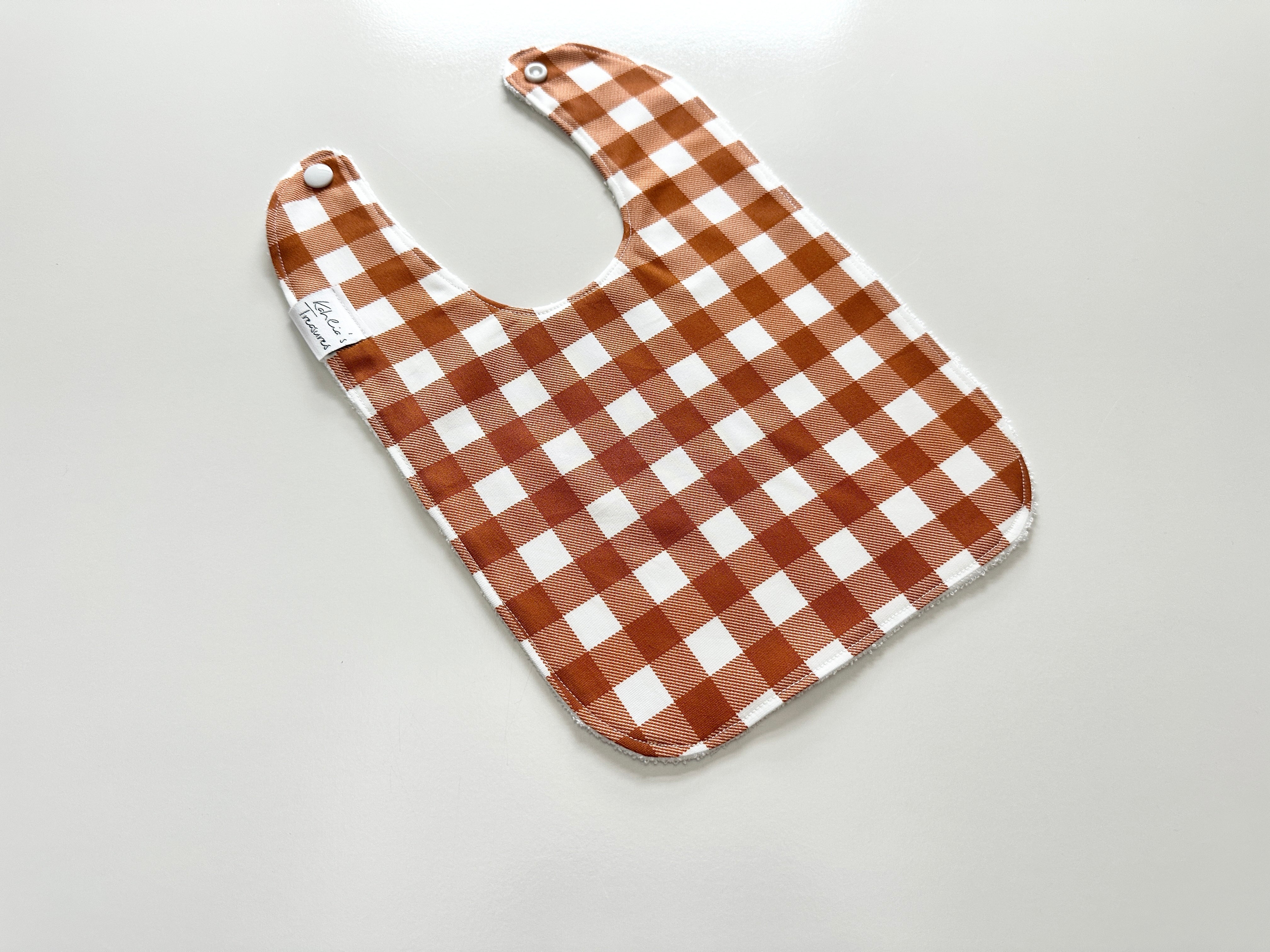 Rust gingham bib
