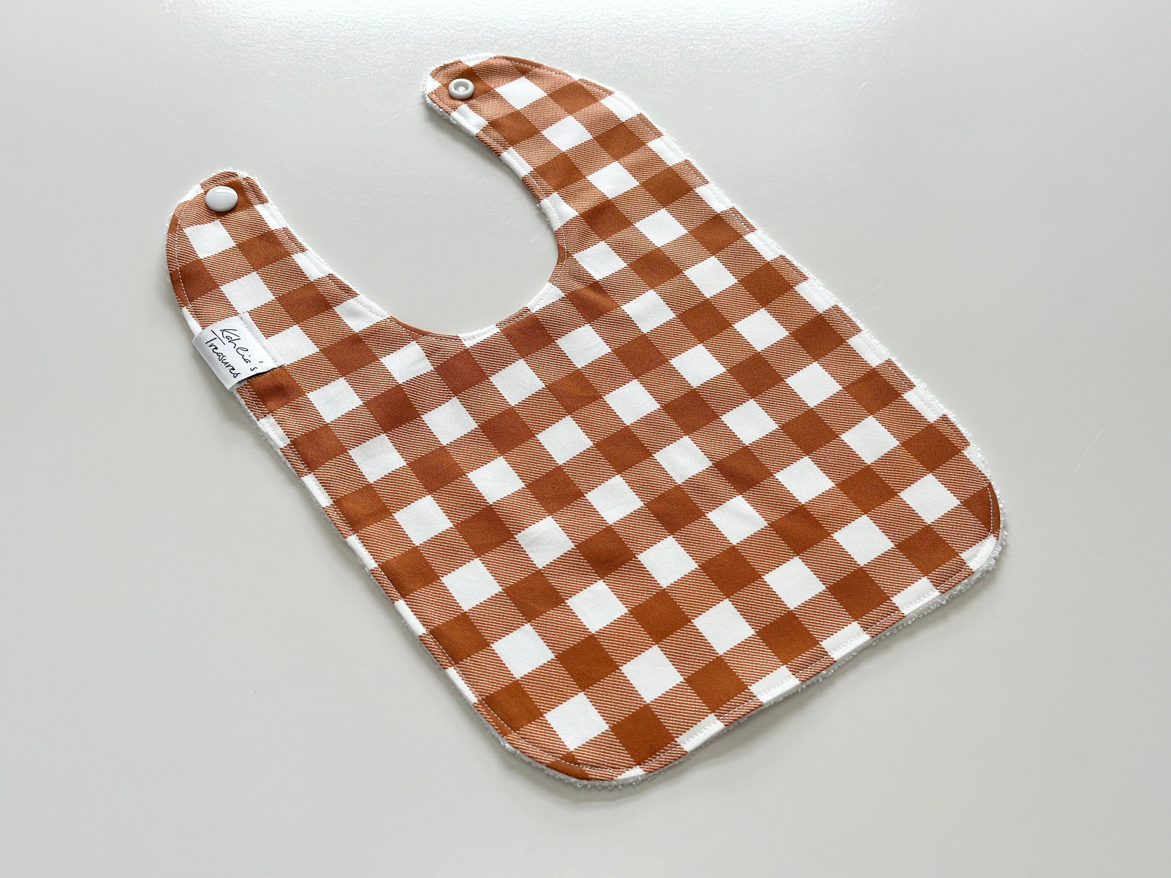 Rust gingham bib