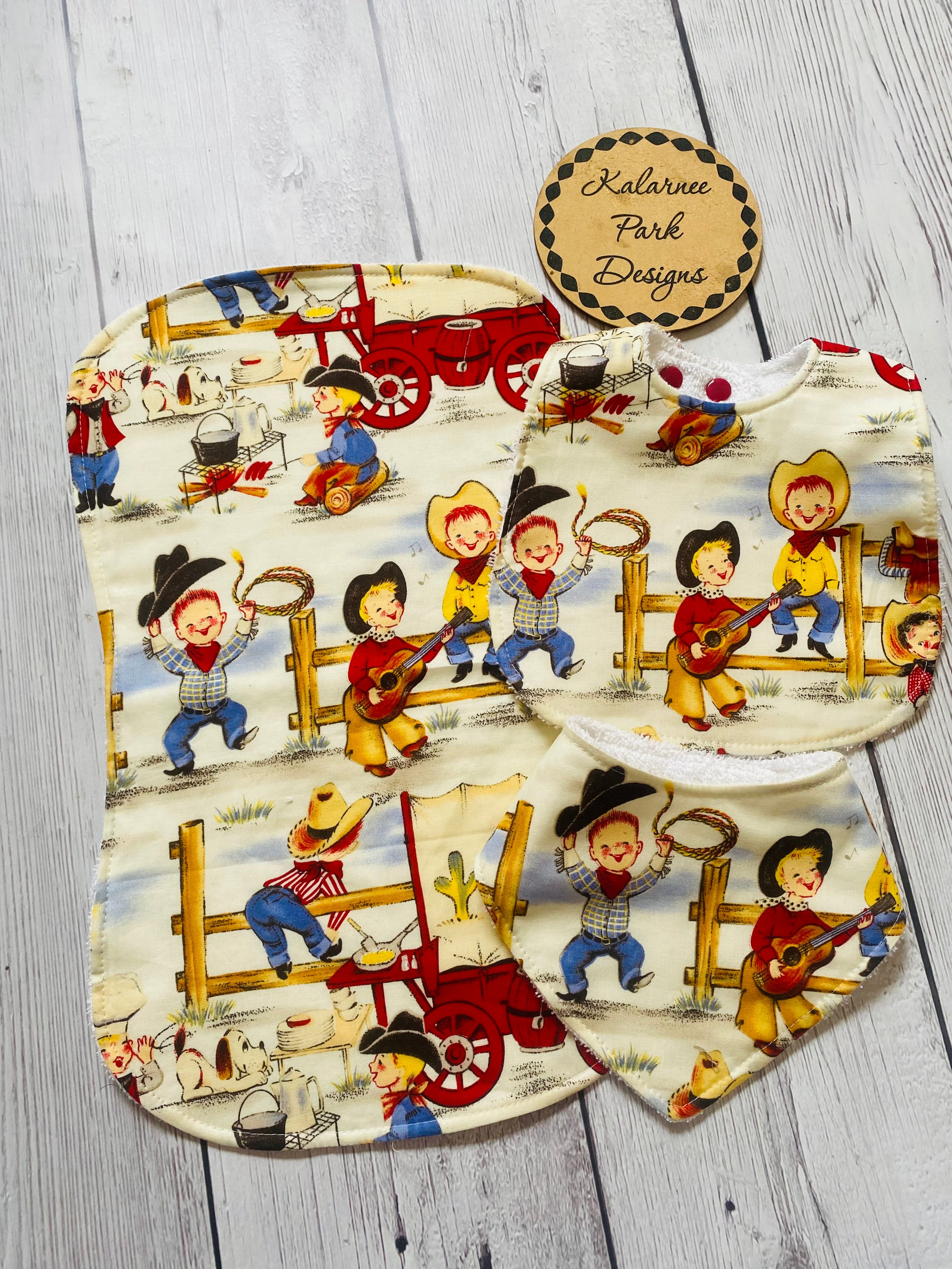 ''Lil Cowpokes'' on Cream Back ground Bib Set Includes Regular Bib Bandana Bib and Burp Cloth